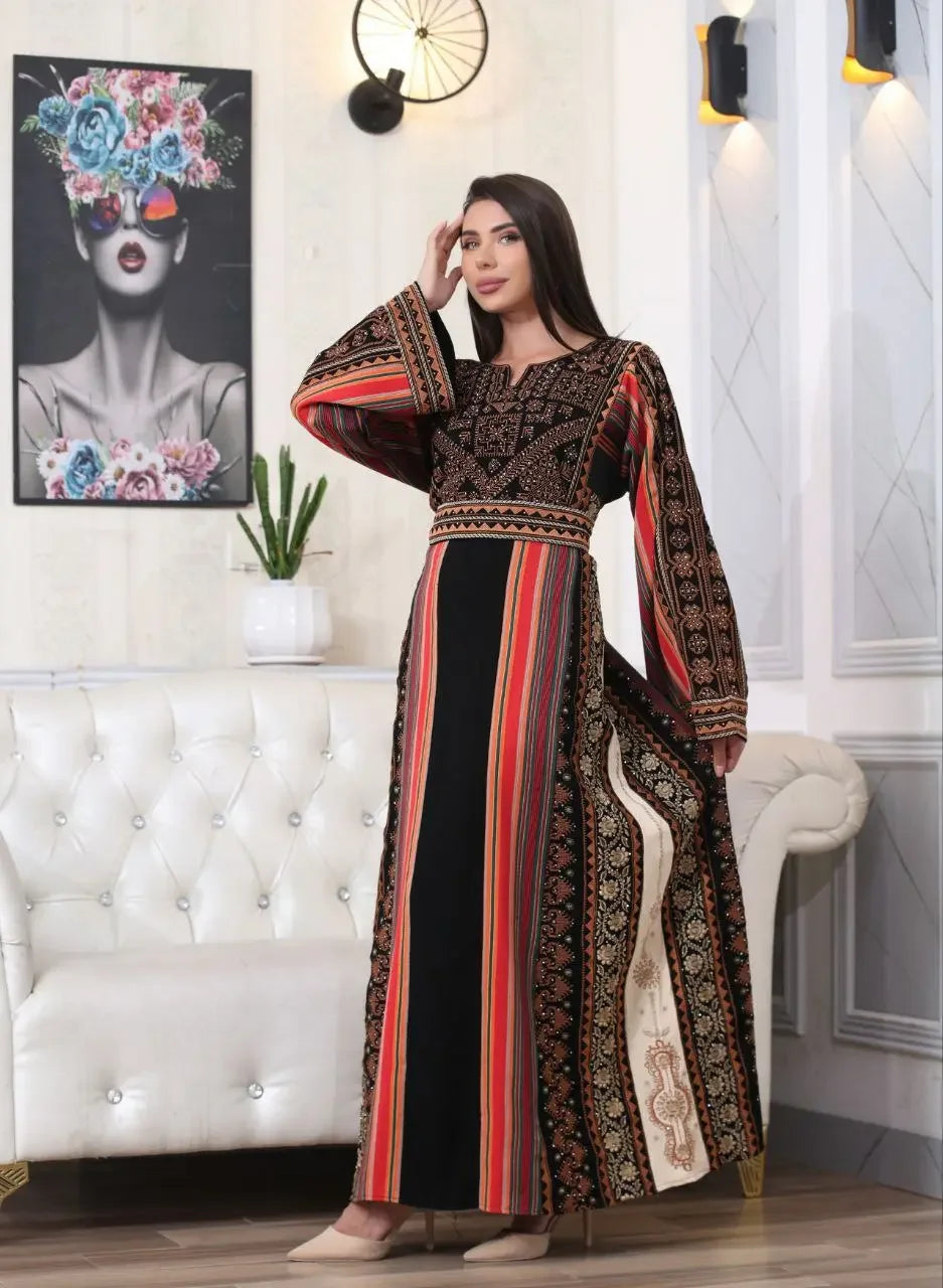 Woman wearing a Brown Majdalwi Embroidered Dress with traditional Palestinian patterns by Palestinian Elegance