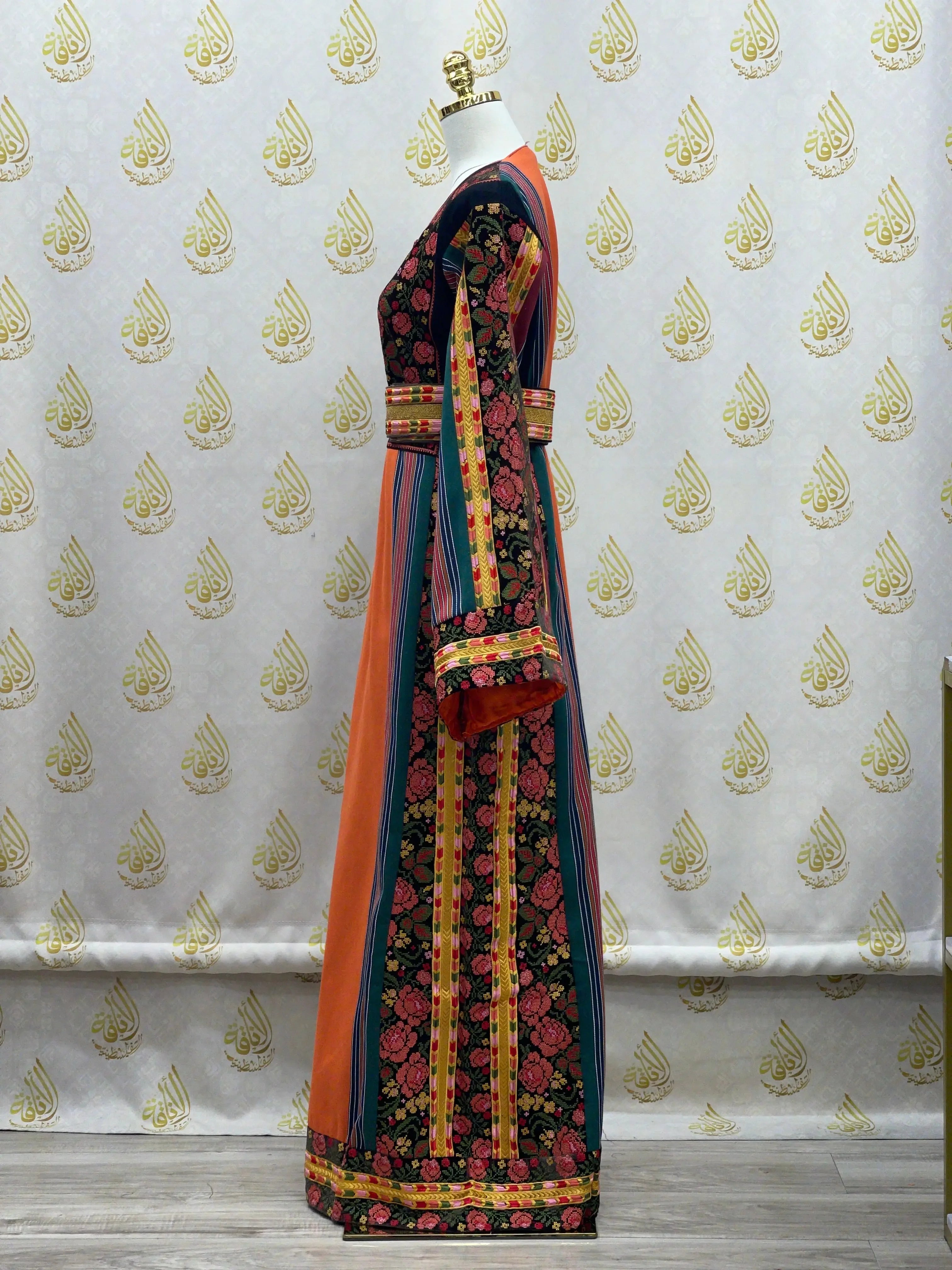 Brown Velvet Orange Majdlawi Thoub embroidered traditional dress by Palestinian Elegance shown on mannequin