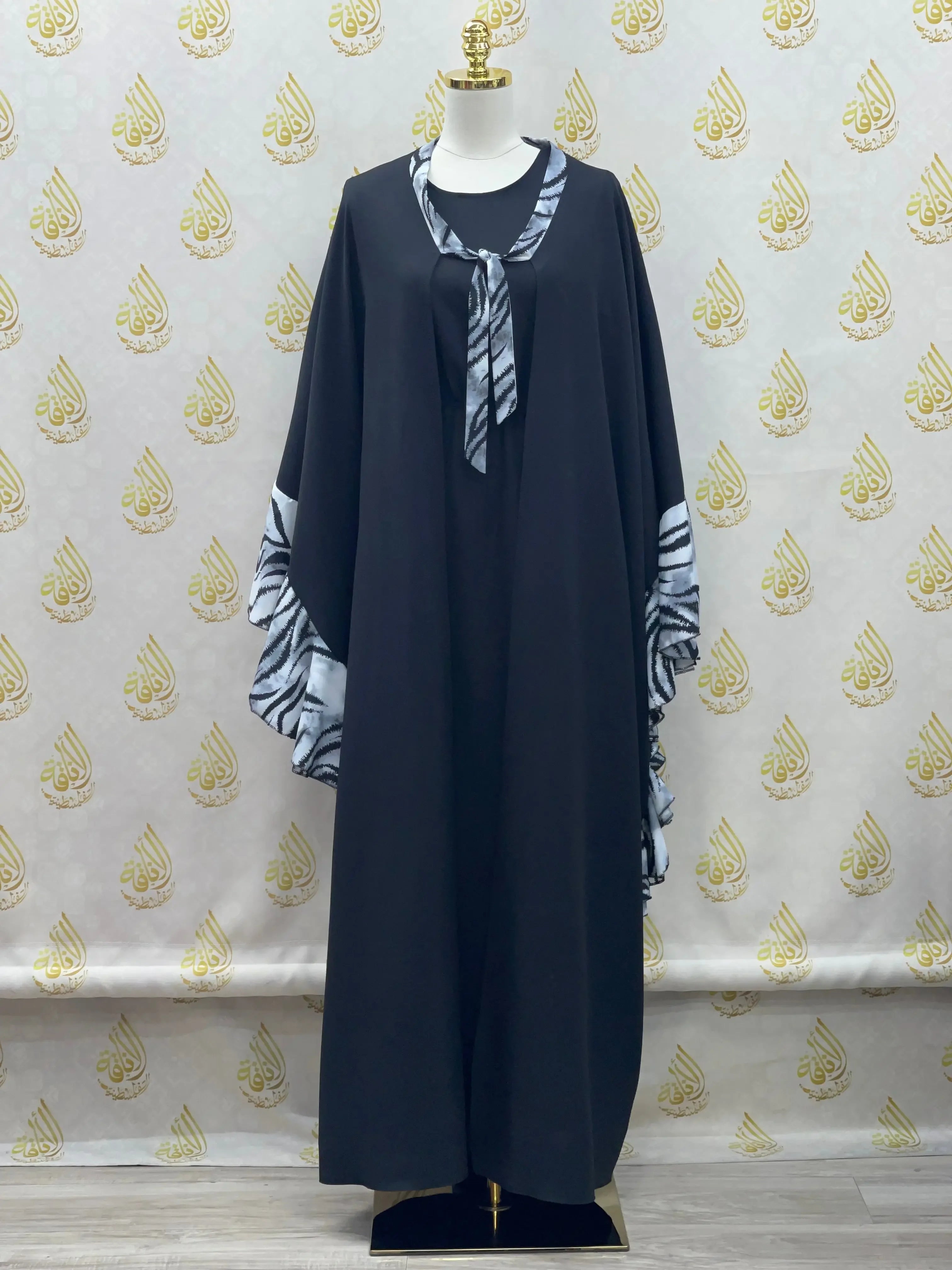 Palestinian Elegance black butterfly abaya dress with patterned sleeves and front tie detail