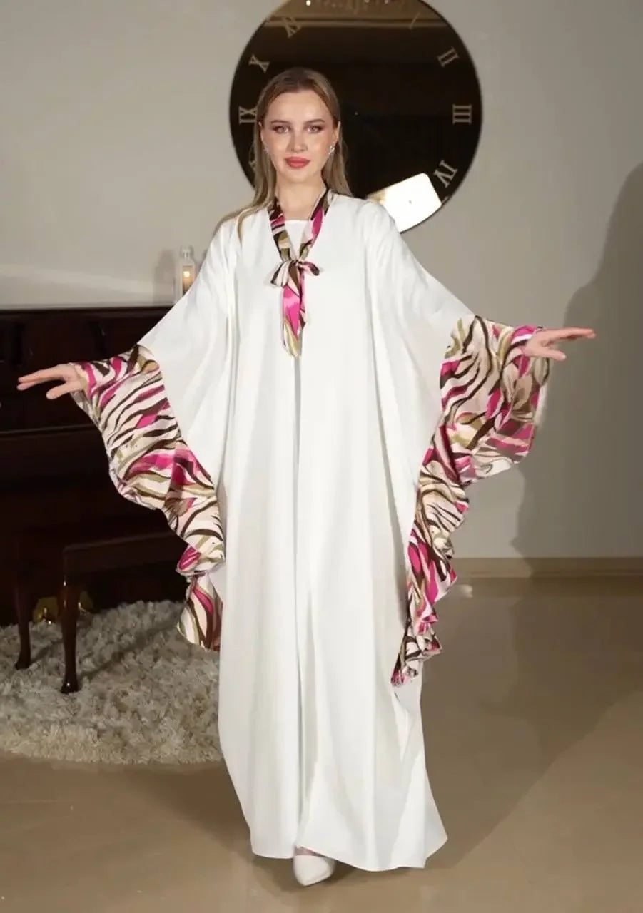 Palestinian Elegance white butterfly abaya dress with pink and brown patterned ruffled sleeves