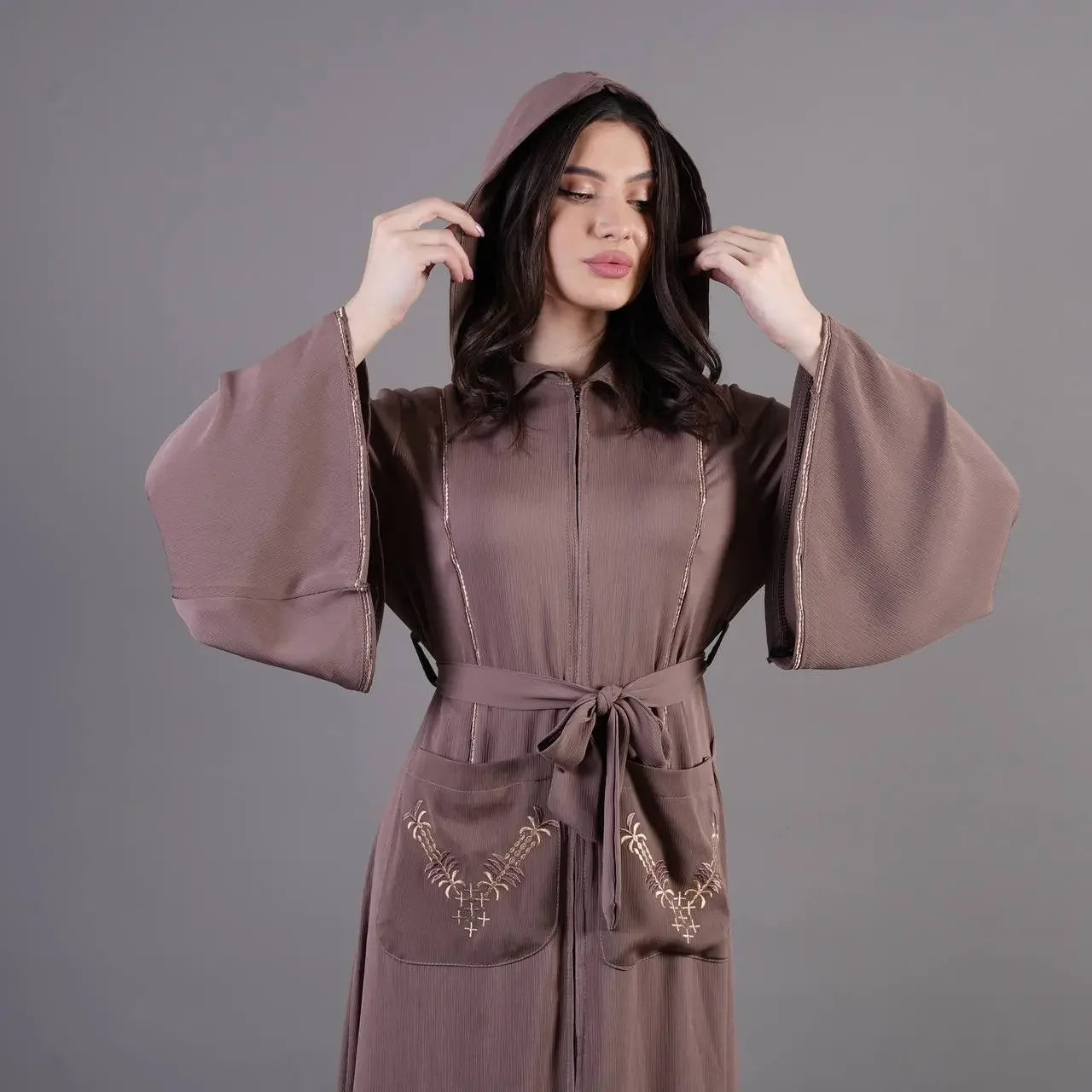Palestinian Elegance chic pocket abaya in soft brown with embroidered pockets and wide bell sleeves