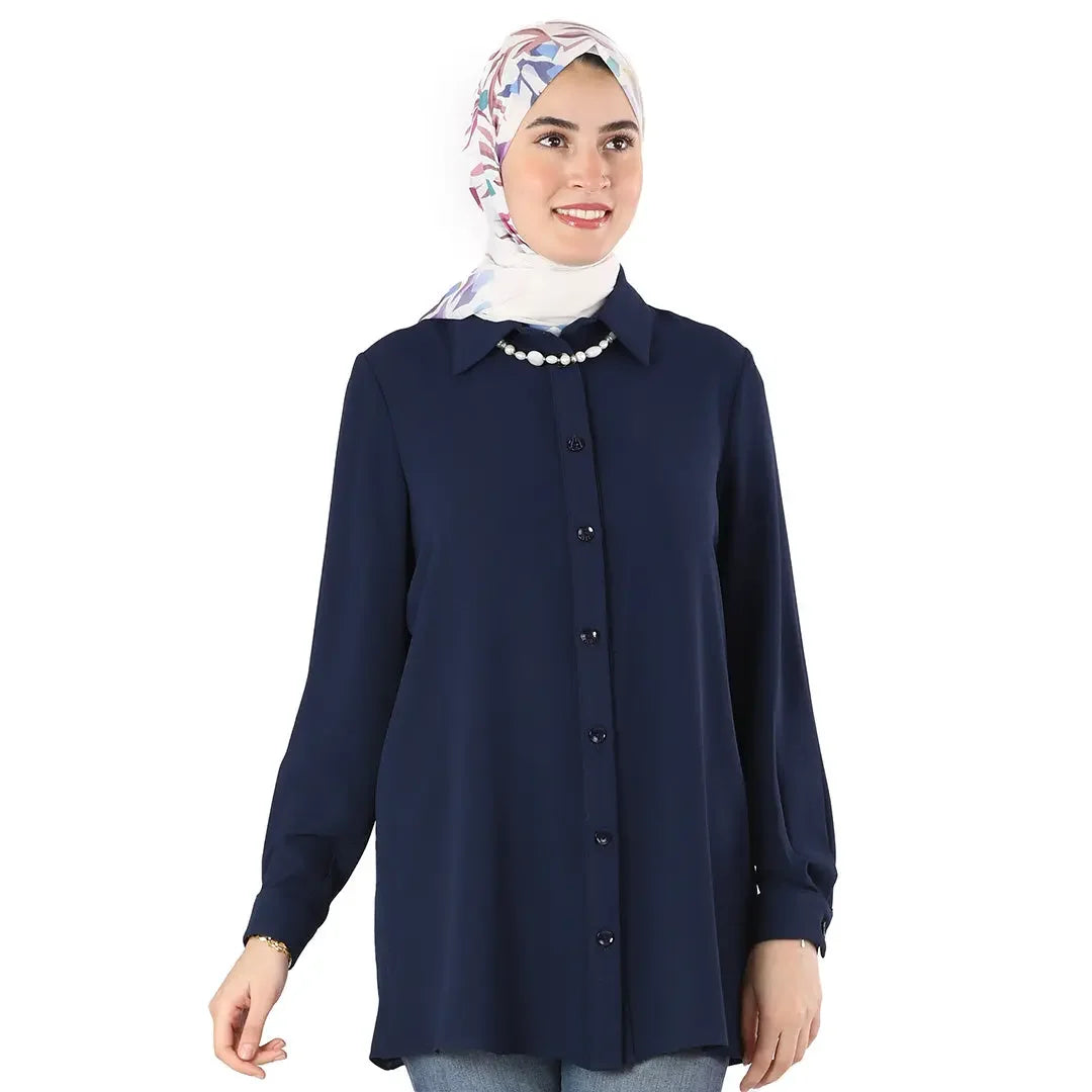 Palestinian Elegance classic button up shirt in navy blue worn with a floral hijab