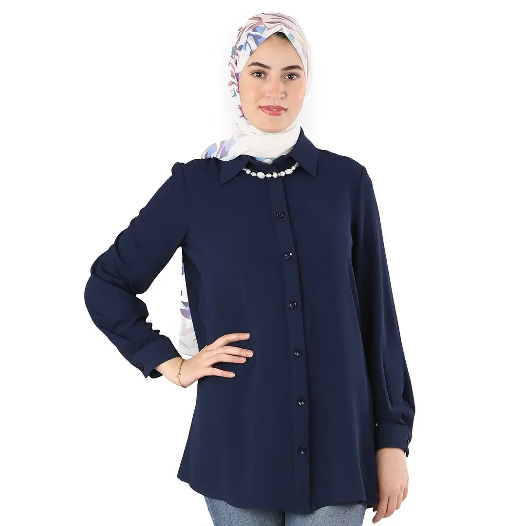 Palestinian Elegance navy classic button up shirt worn by woman with floral headscarf and pearl necklace