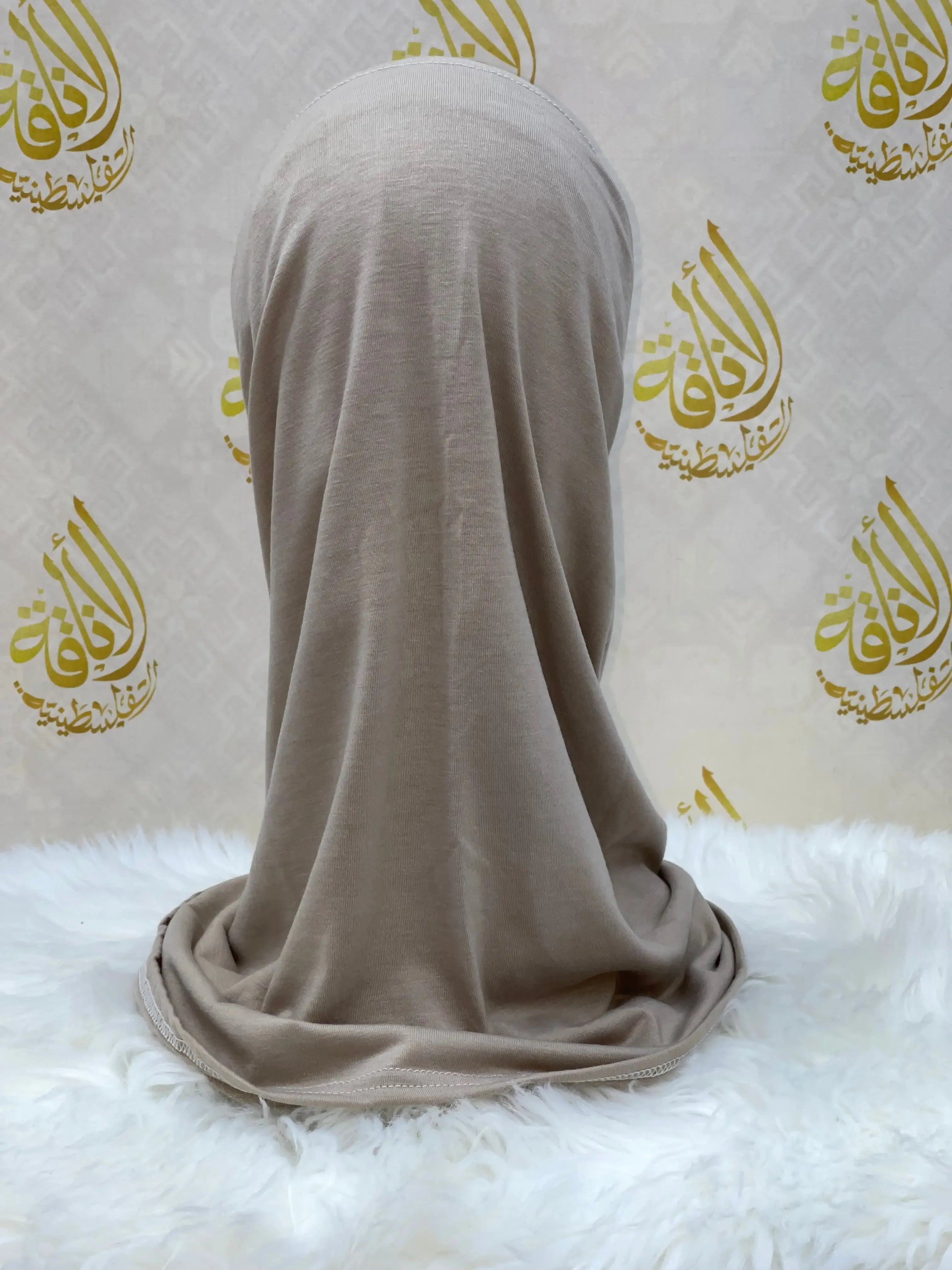 Palestinian Elegance beige cotton hijab for women displayed on a mannequin with soft fabric drape