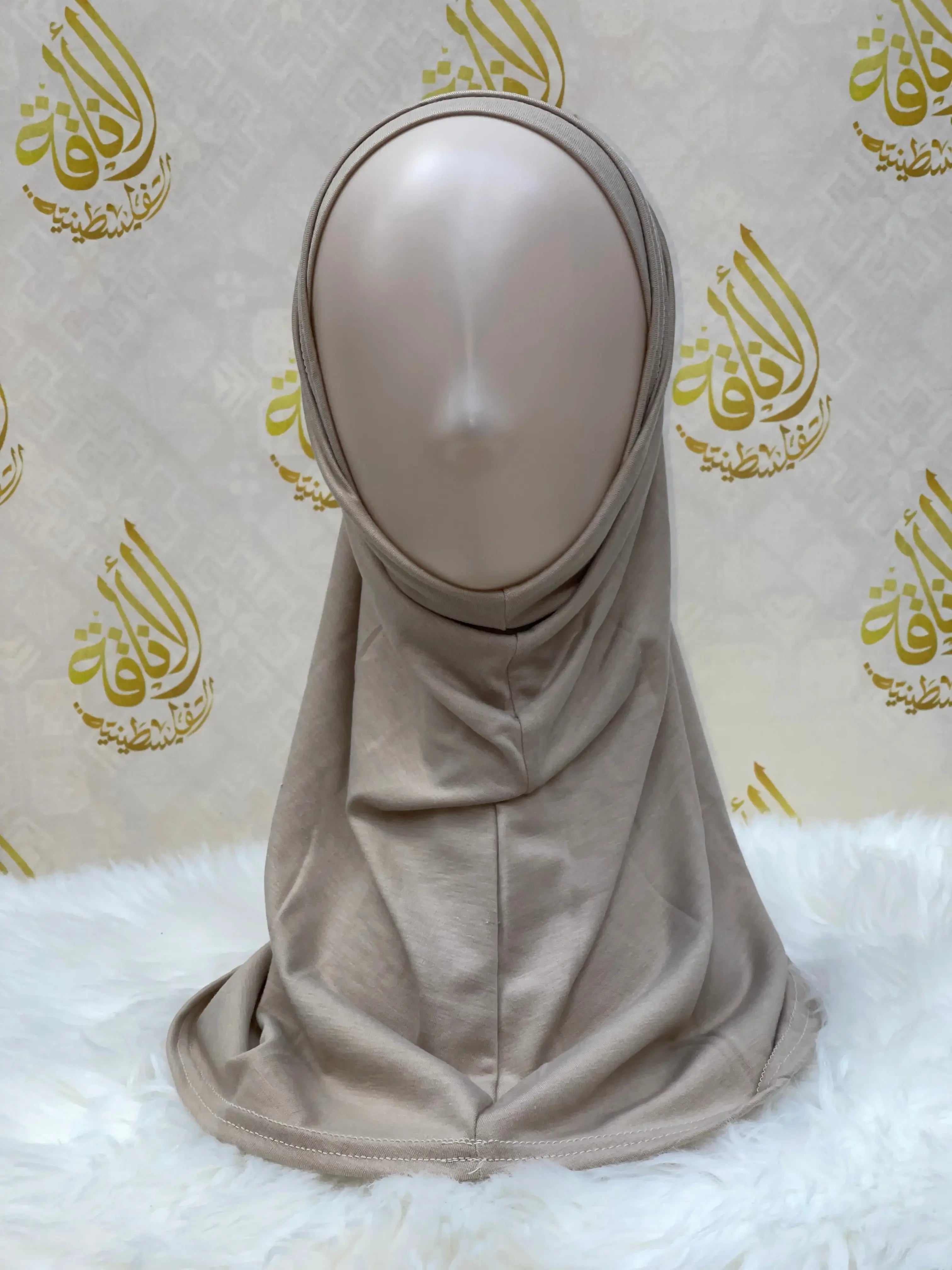Beige Palestinian Elegance cotton hijab for women displayed on a mannequin with smooth fabric drape