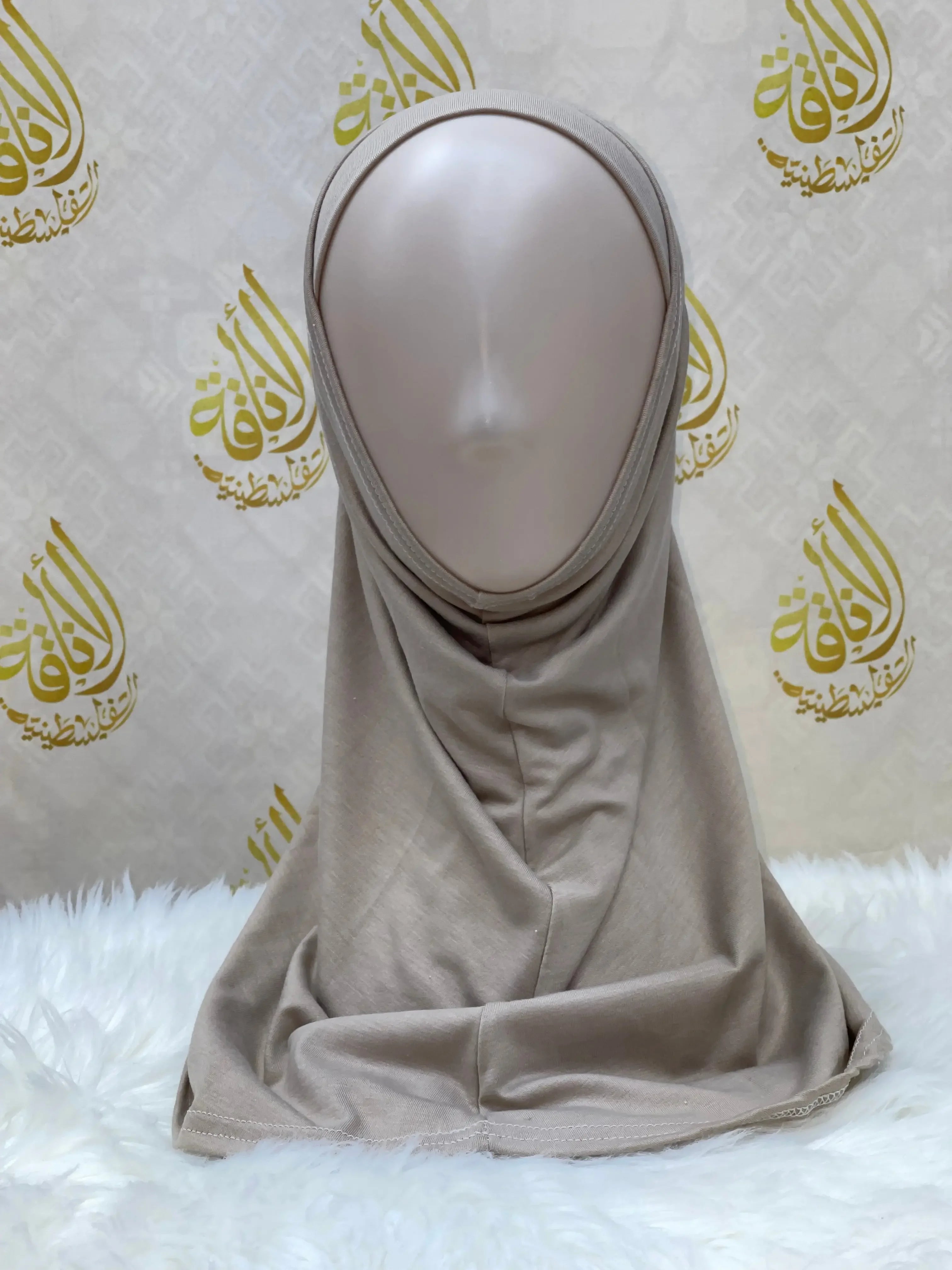 Palestinian Elegance beige cotton hijab for women displayed on a mannequin with smooth fabric texture