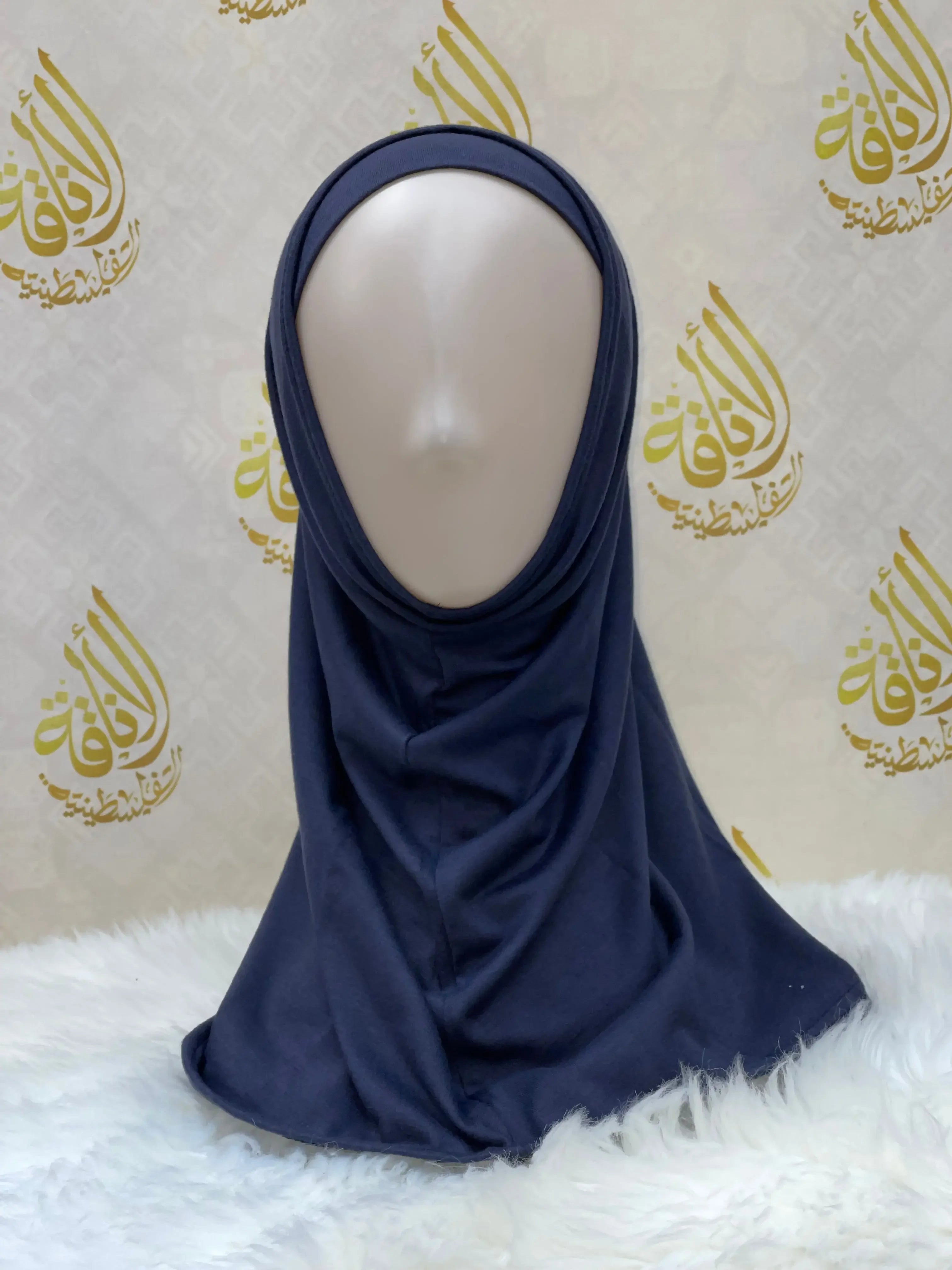 Palestinian Elegance navy blue cotton hijab for women displayed on a mannequin with soft fabric draping
