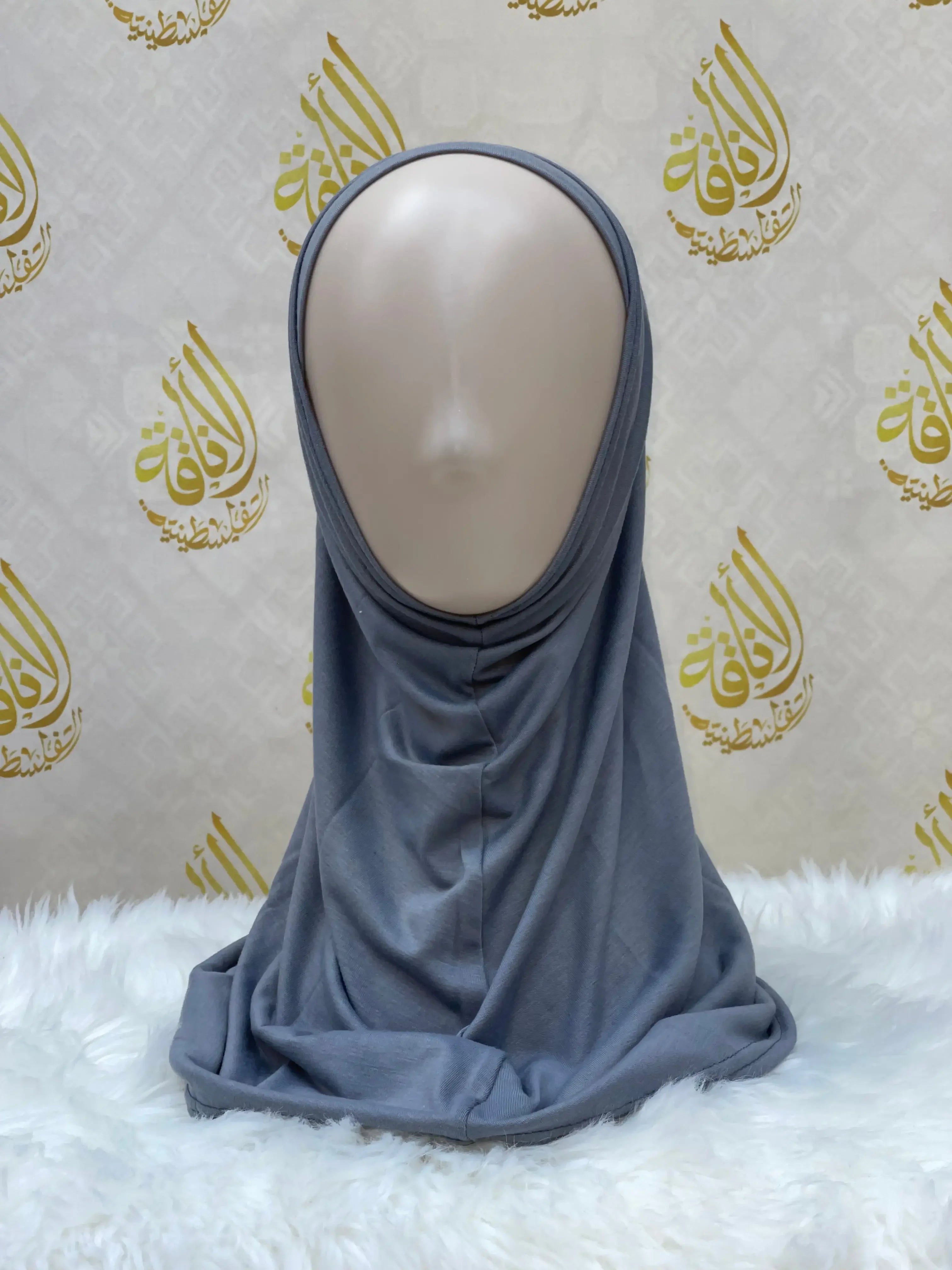 Gray cotton hijab for women displayed on a mannequin by Palestinian Elegance