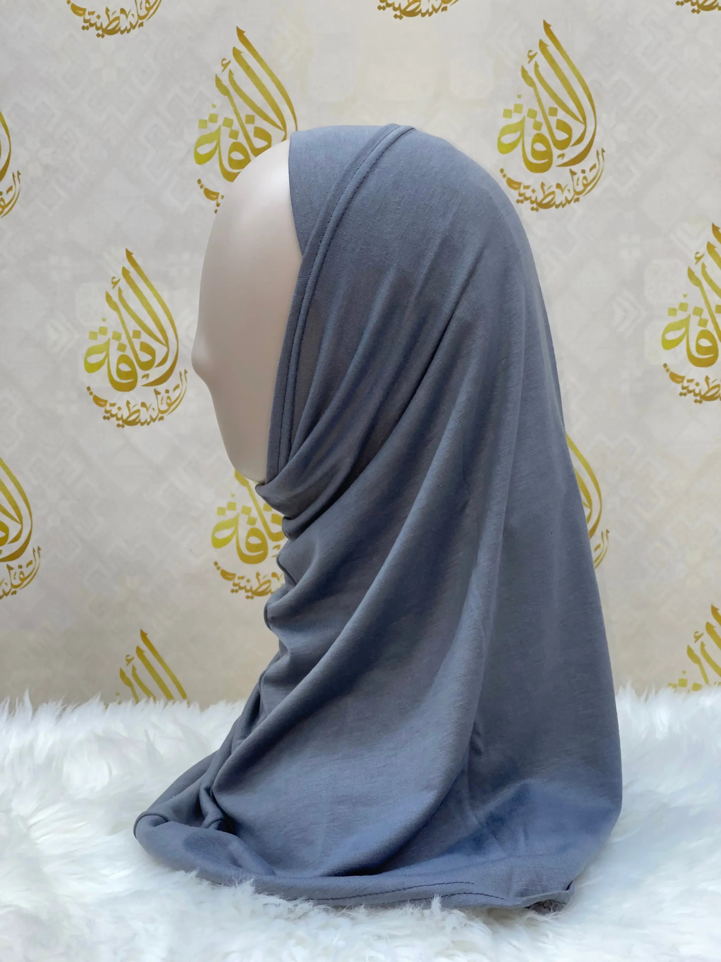 Gray cotton hijab for women draped on a mannequin by Palestinian Elegance
