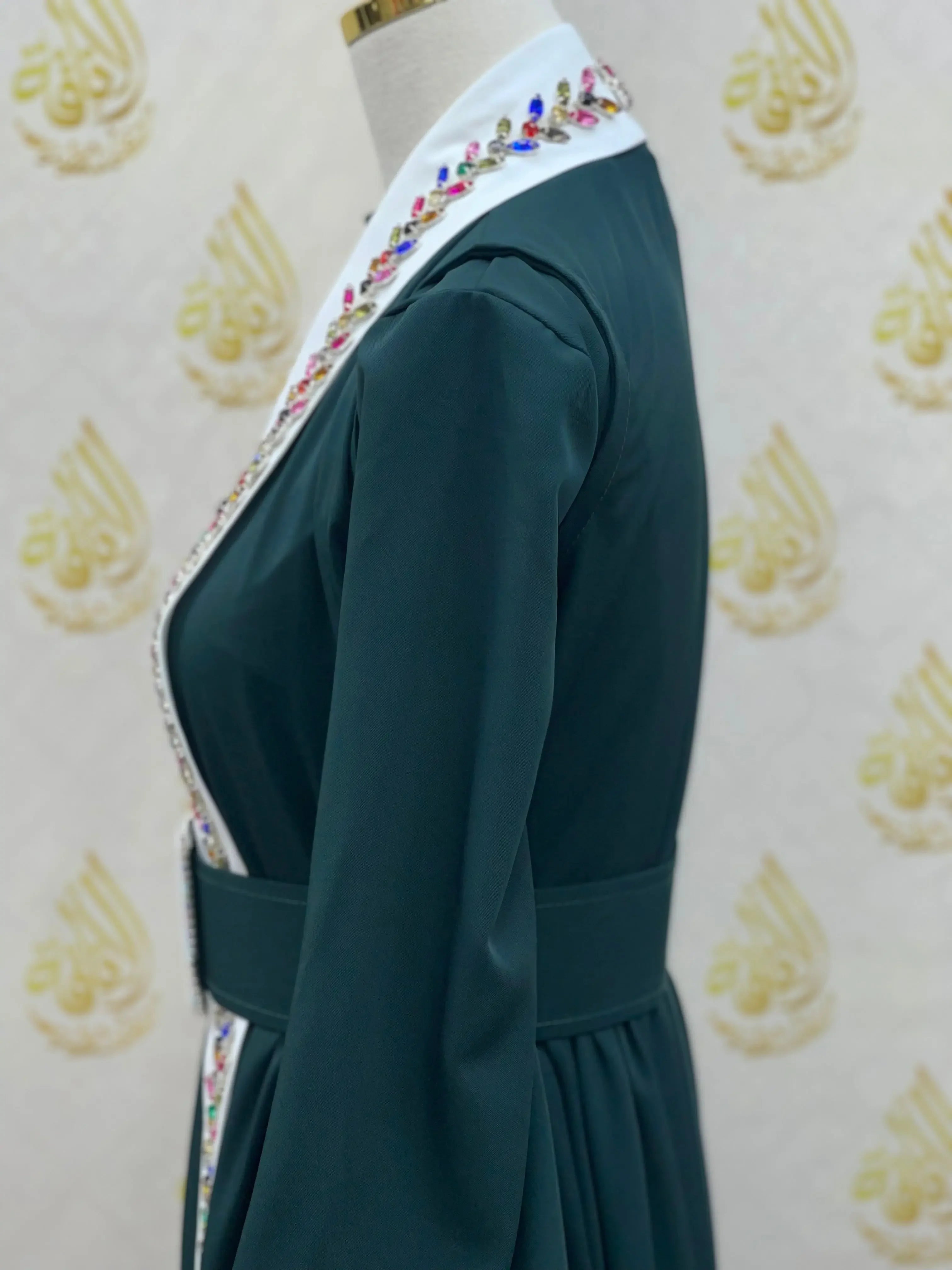 Side view of Palestinian Elegance crystal kaftan dress with colorful crystal-embellished white collar