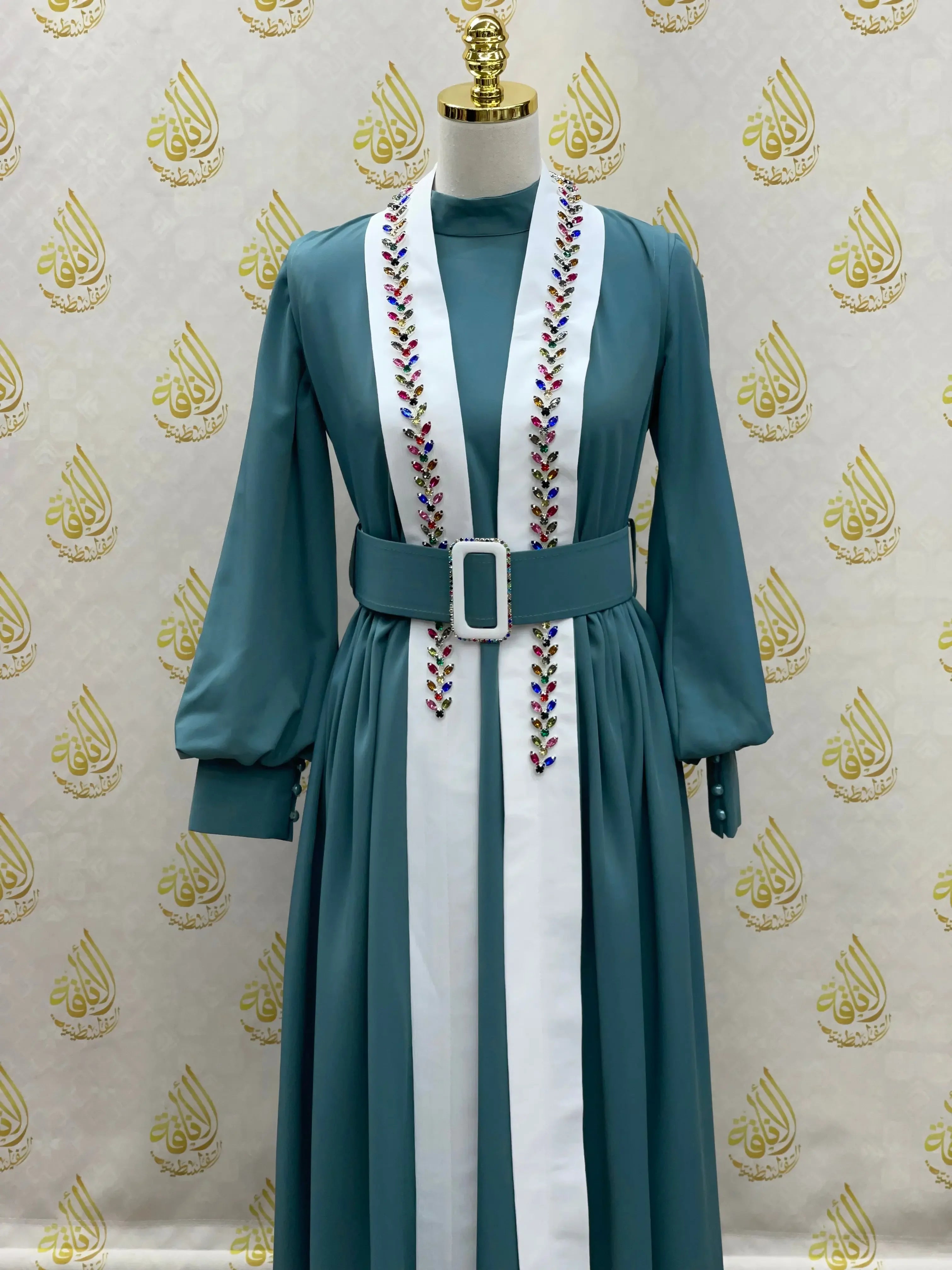 Palestinian Elegance crystal kaftan dress in teal with white front panels and colorful embroidery