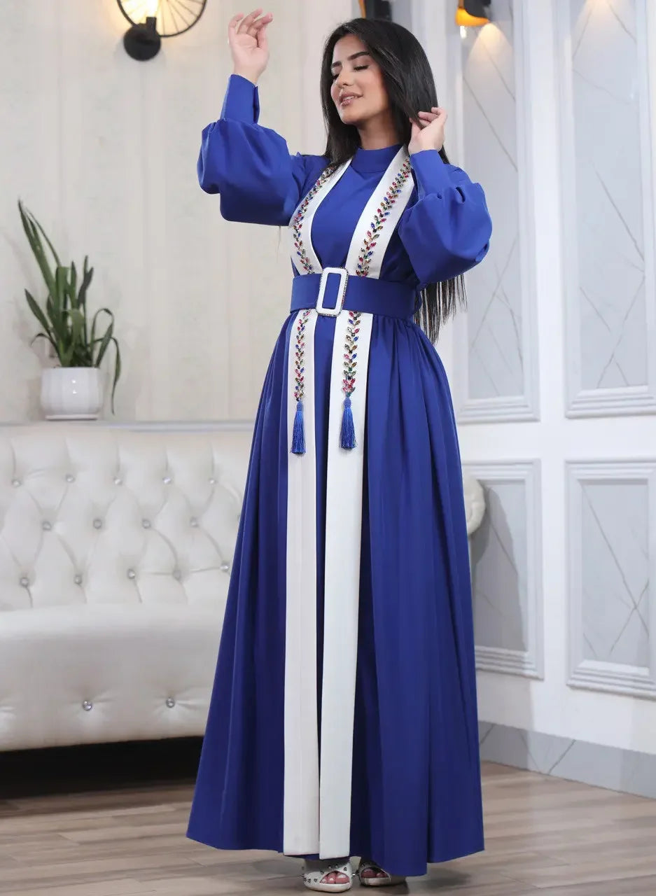 Palestinian Elegance blue and white crystal kaftan dress with long sleeves and embroidered details