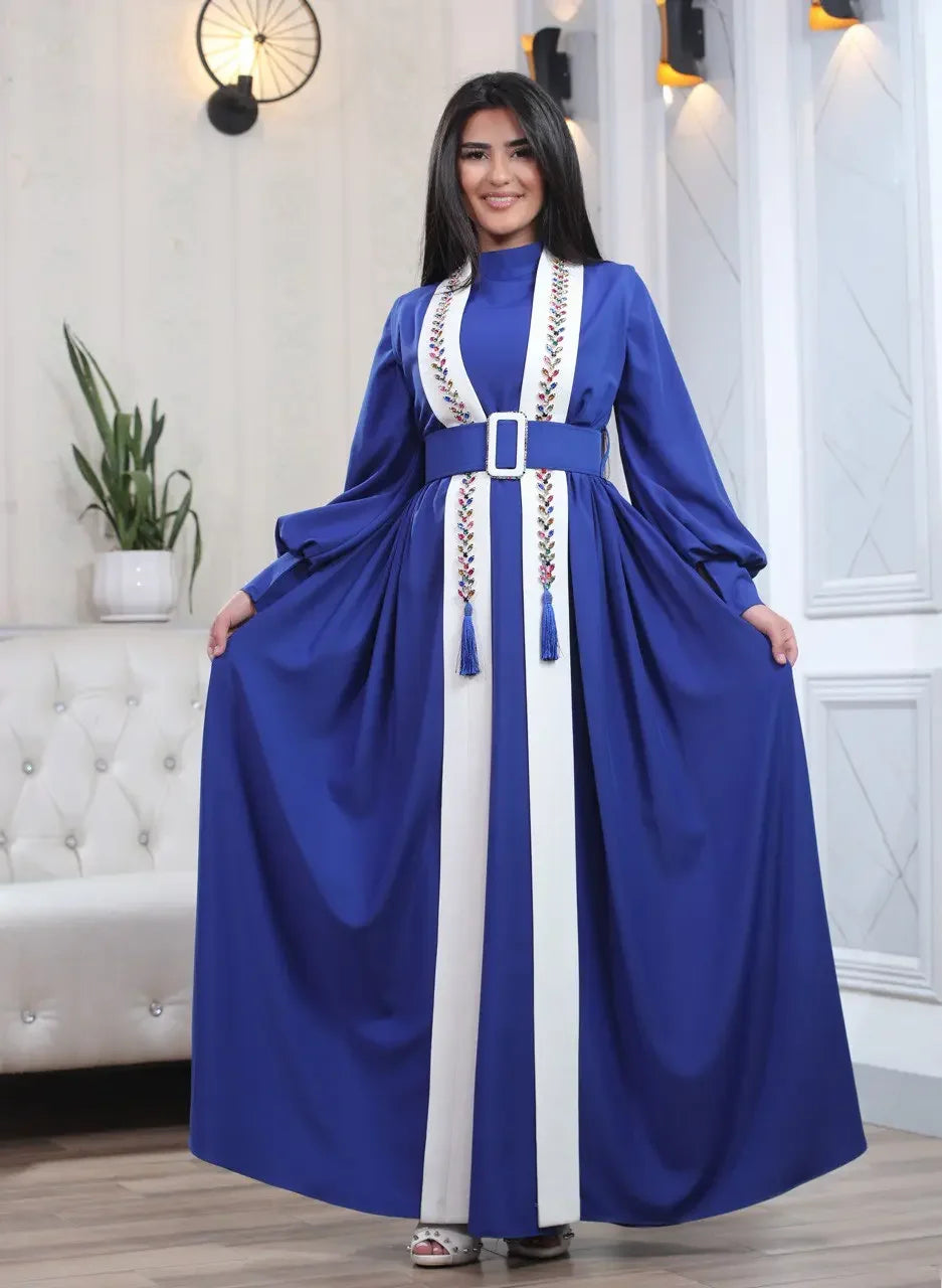 Palestinian Elegance crystal kaftan dress in blue with white accents and embroidered details