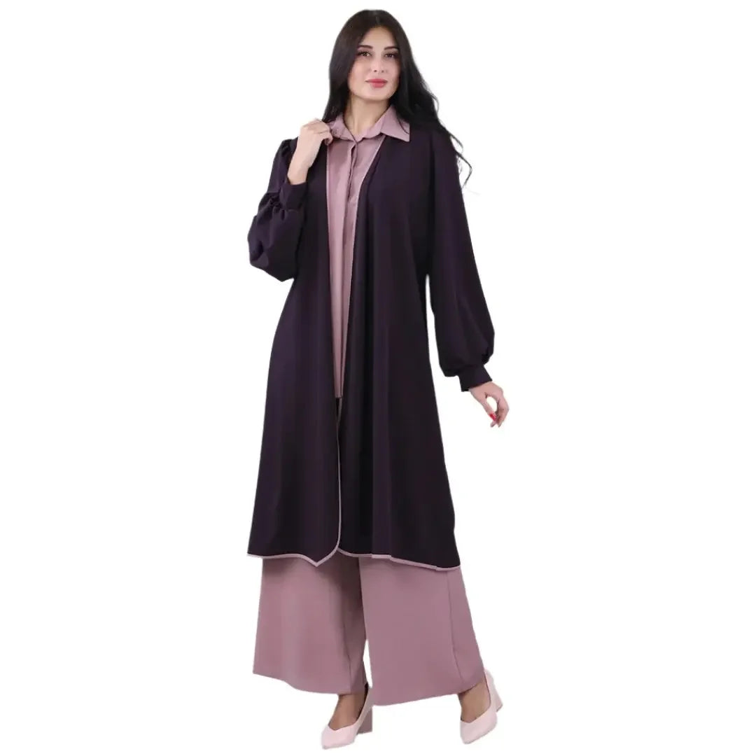 Palestinian Elegance long black cardigan with balloon sleeves styled over mauve wide-leg pants and shirt