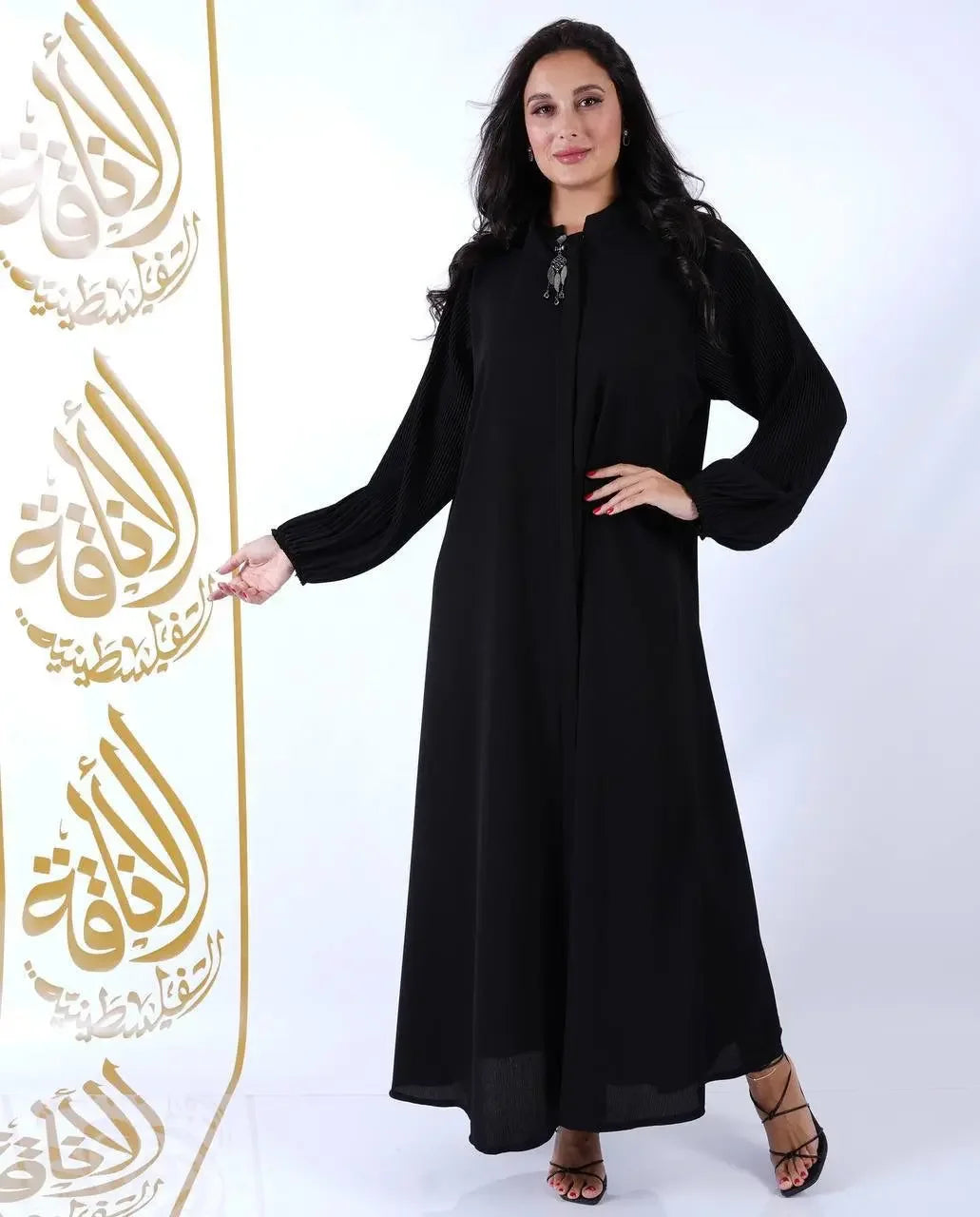 Palestinian Elegance black elastic sleeve abaya for women with long puffed sleeves and front closure