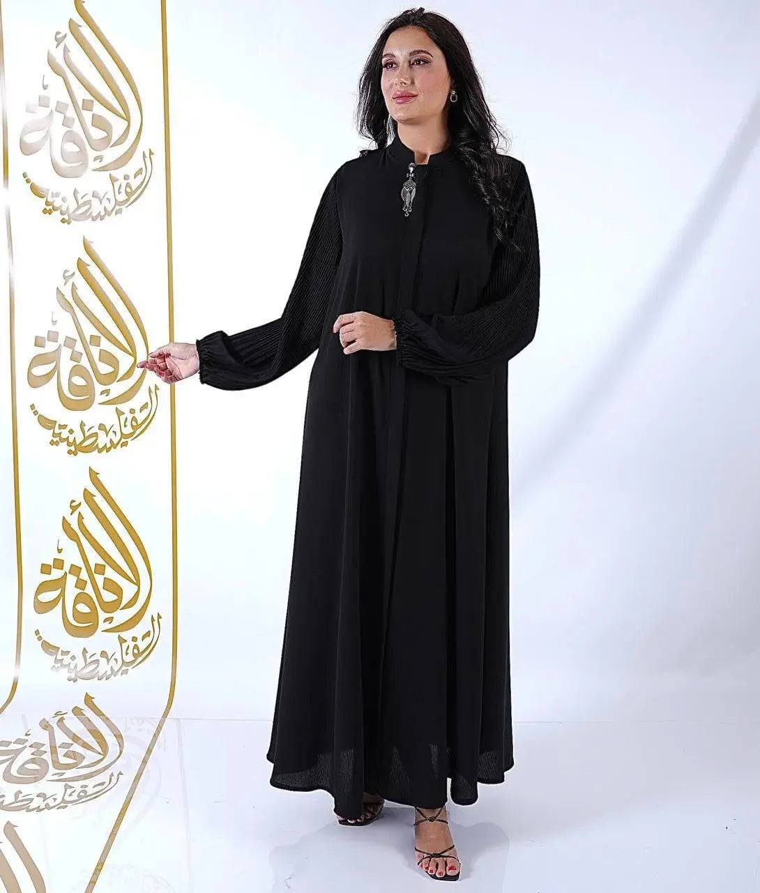 Black elastic sleeve abaya for women from Palestinian Elegance with a modest flowing design