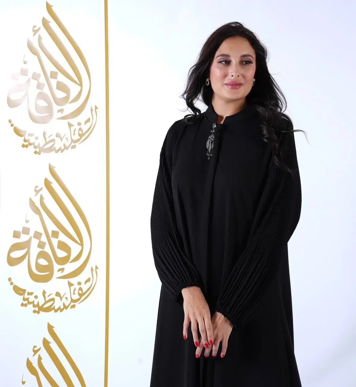 Palestinian Elegance black elastic sleeve abaya for women with pleated sleeves and modest design