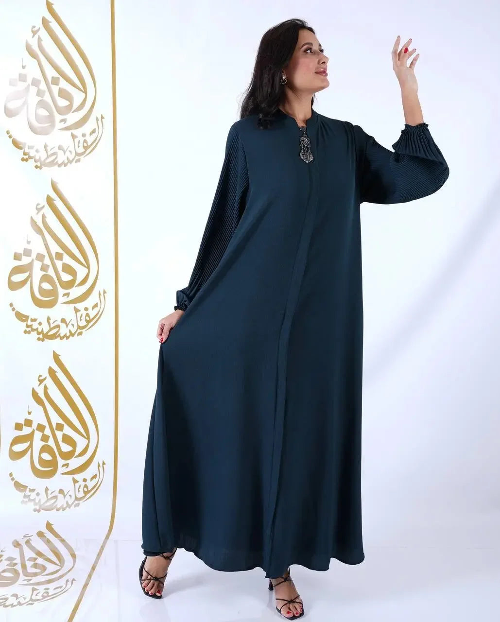 Palestinian Elegance black elastic sleeve abaya for women with long flowy design and cuffed sleeves