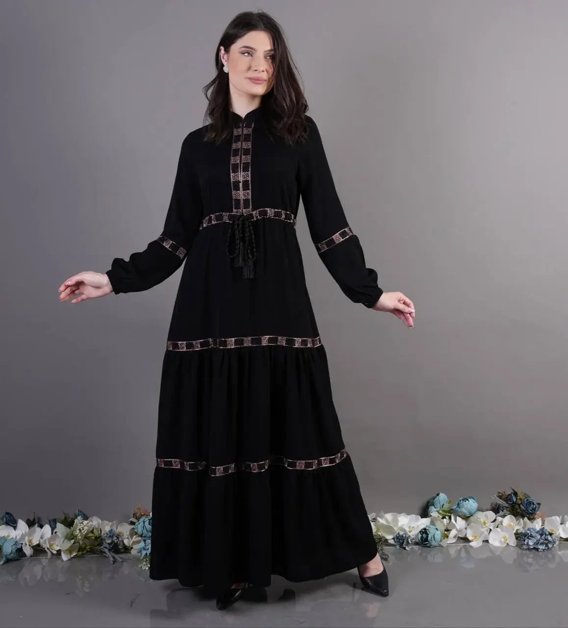Palestinian Elegance black elegant abaya dress with decorative trim and long sleeves