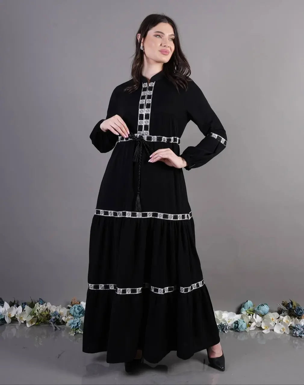 Palestinian Elegance black elegant abaya dress with silver trim and long sleeves