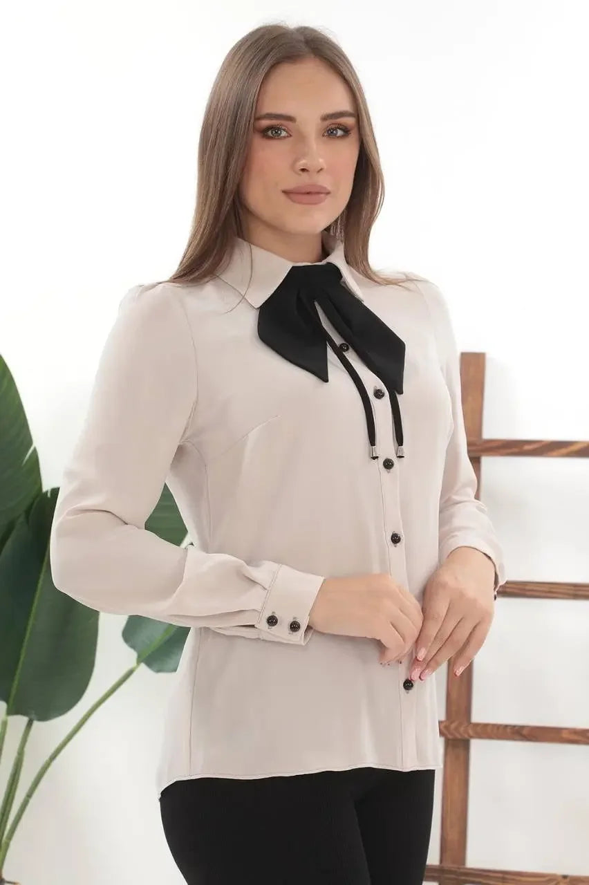 Palestinian Elegance elegant bow tie blouse in cream with black bow and button details