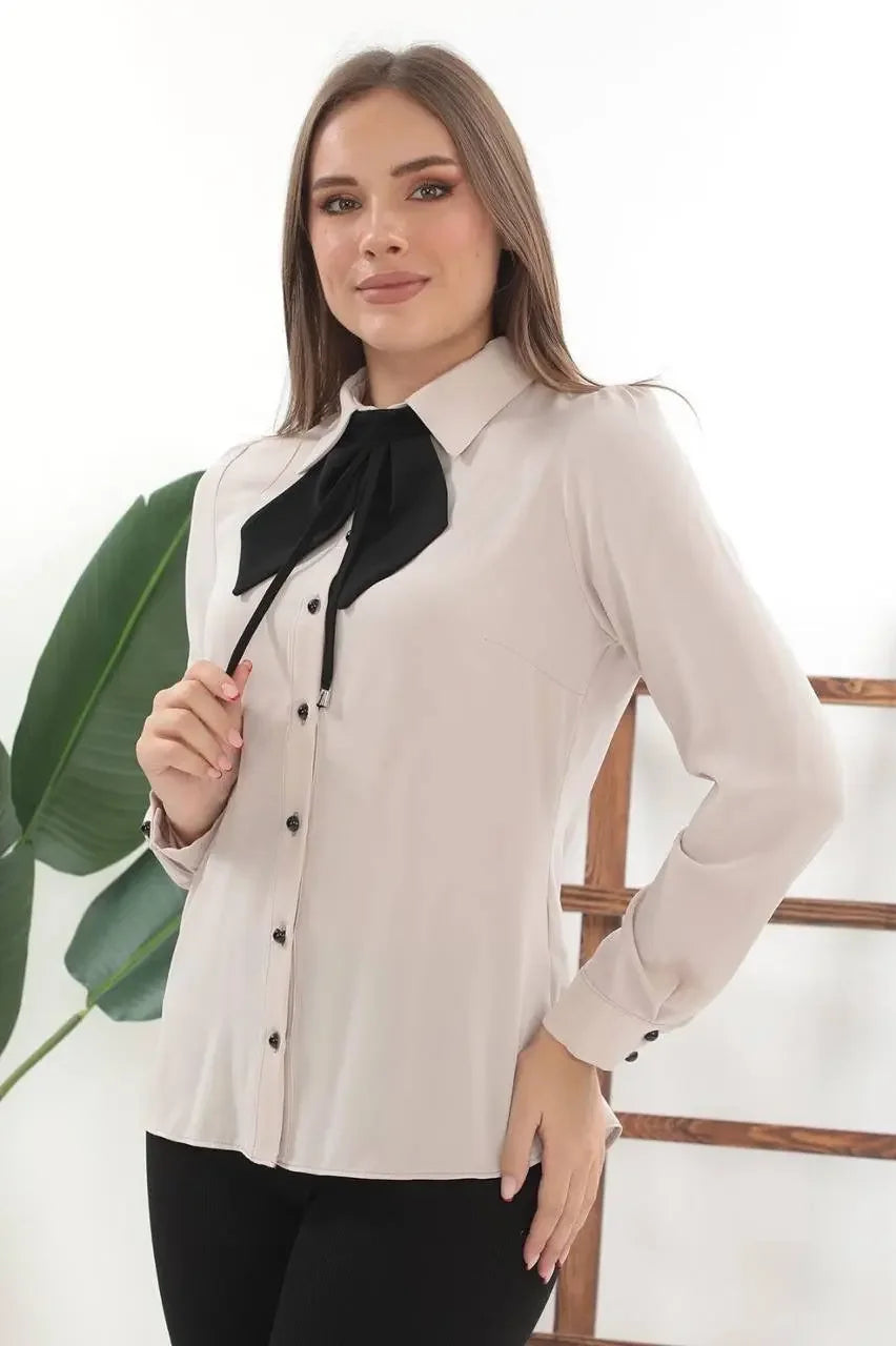 Palestinian Elegance elegant bow tie blouse in beige with black bow and button details