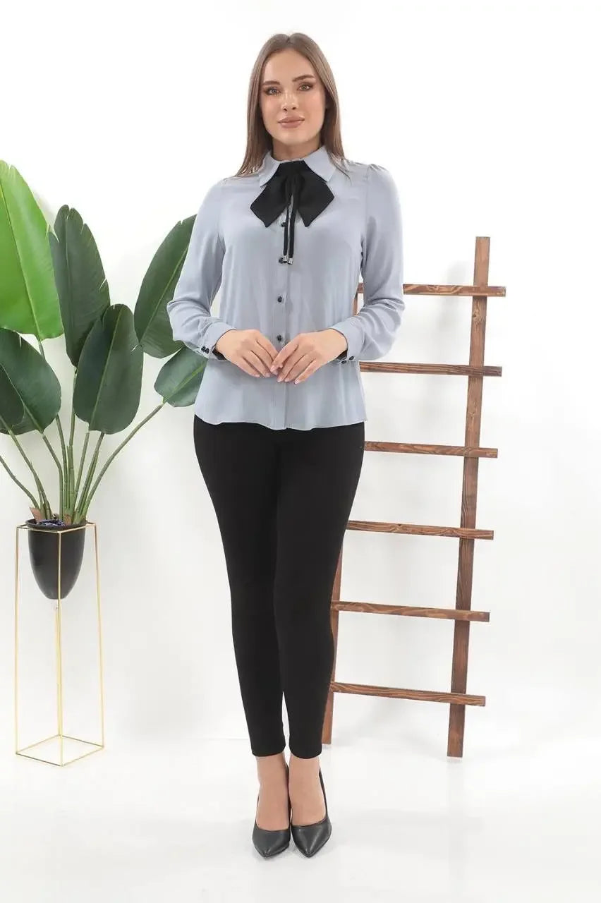 Palestinian Elegance casual outfit featuring a light gray elegant bow tie blouse paired with black pants