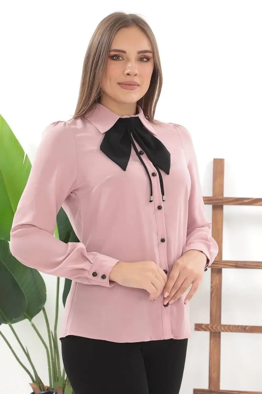 Palestinian Elegance elegant bow tie blouse in pink with black bow and button details