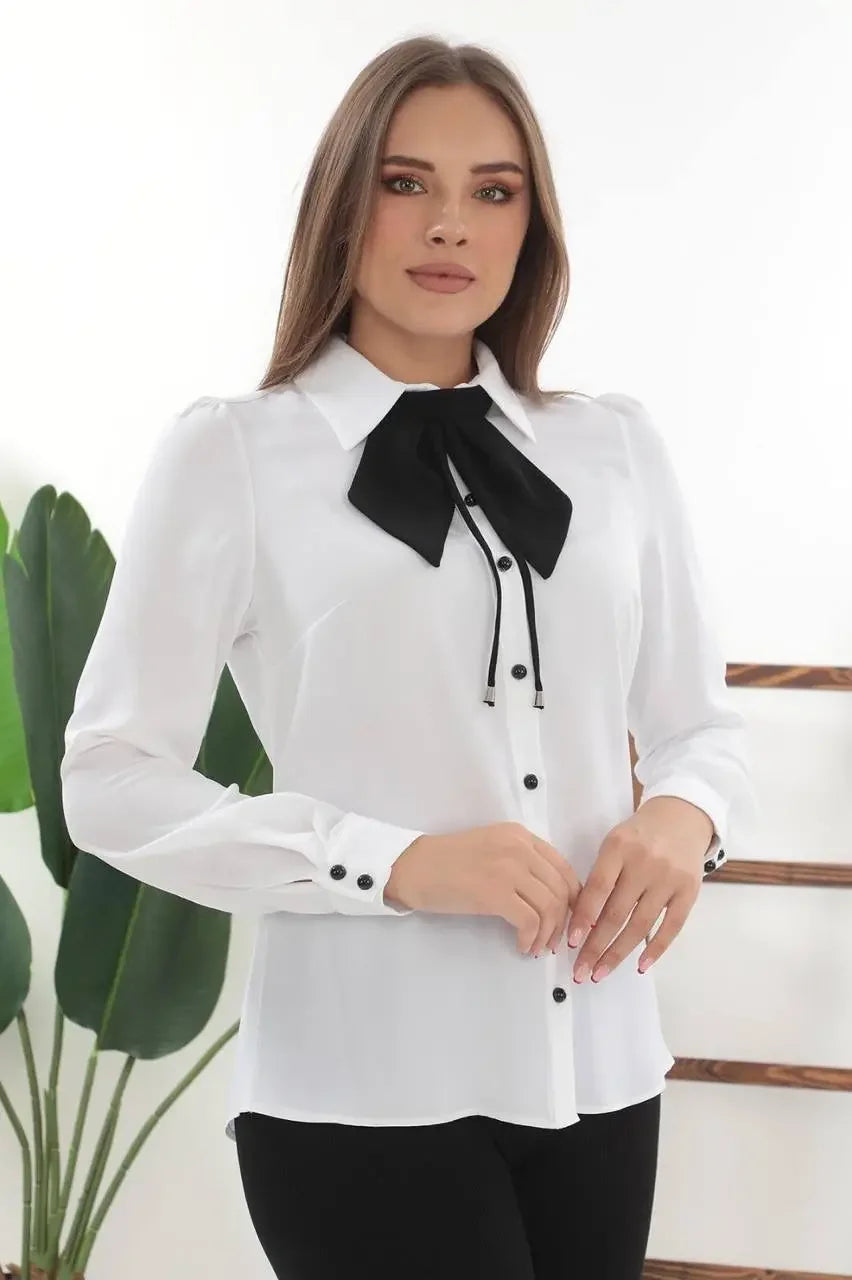 Palestinian Elegance elegant bow tie blouse in white with black bow detail and button-up front