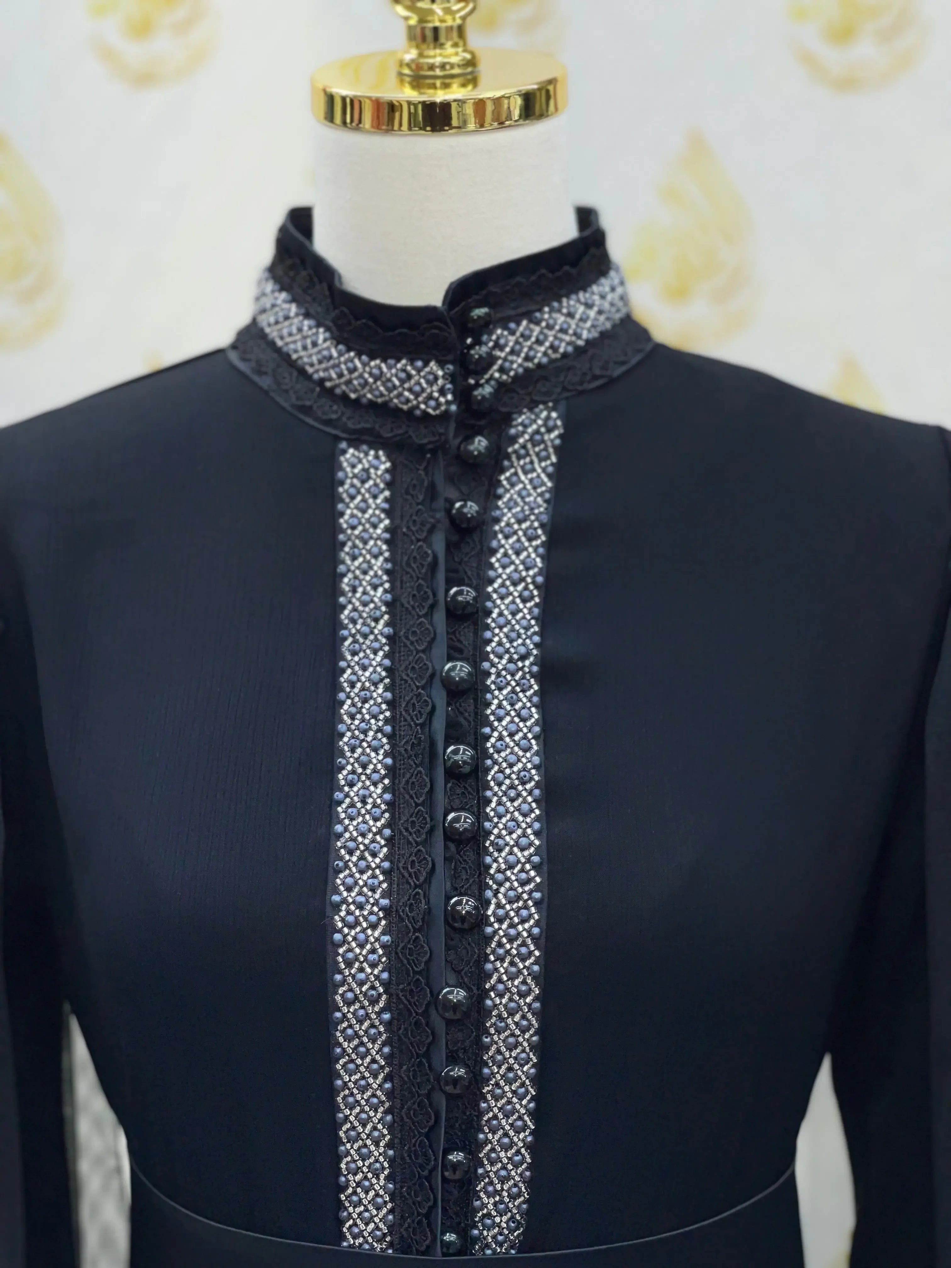 Palestinian Elegance black elegant modest formal dress with decorative front buttons and intricate embroidery