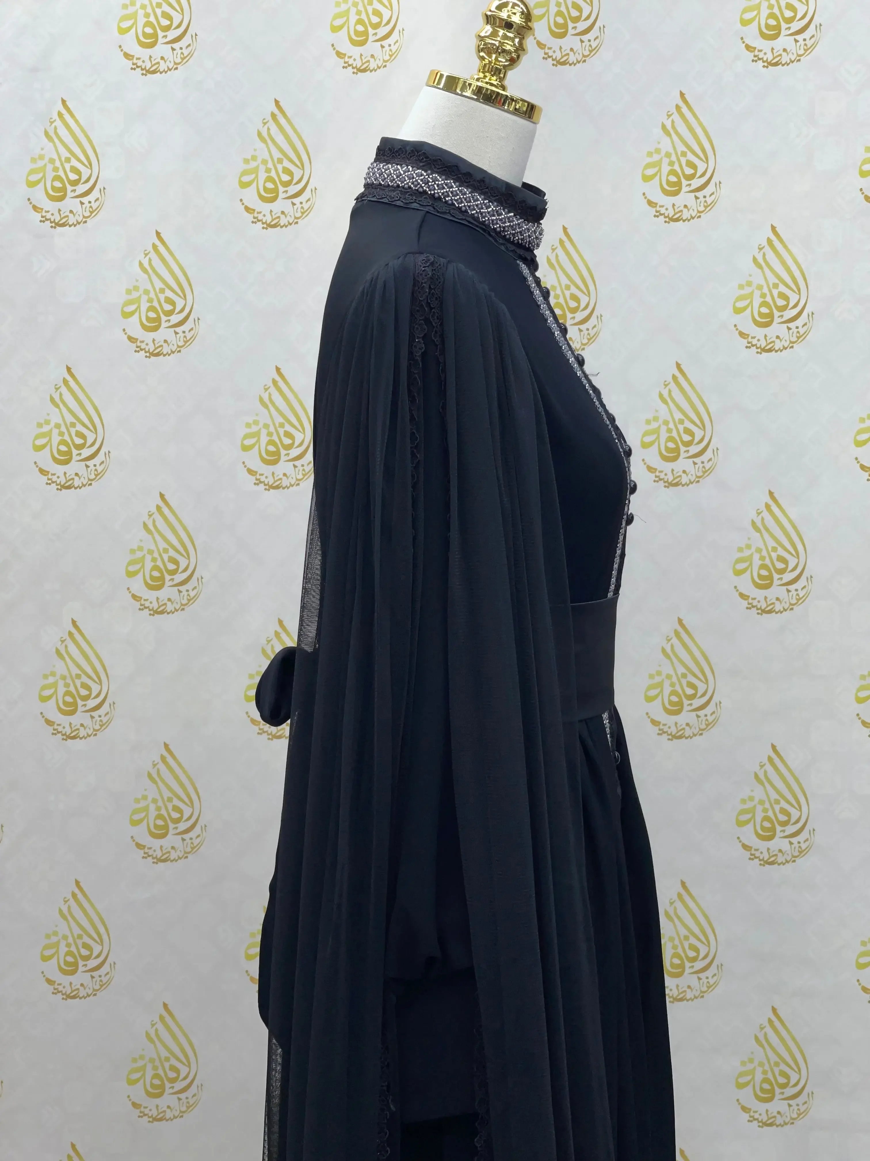 Palestinian Elegance black elegant modest formal dress with detailed high neck and flowing sheer sleeves