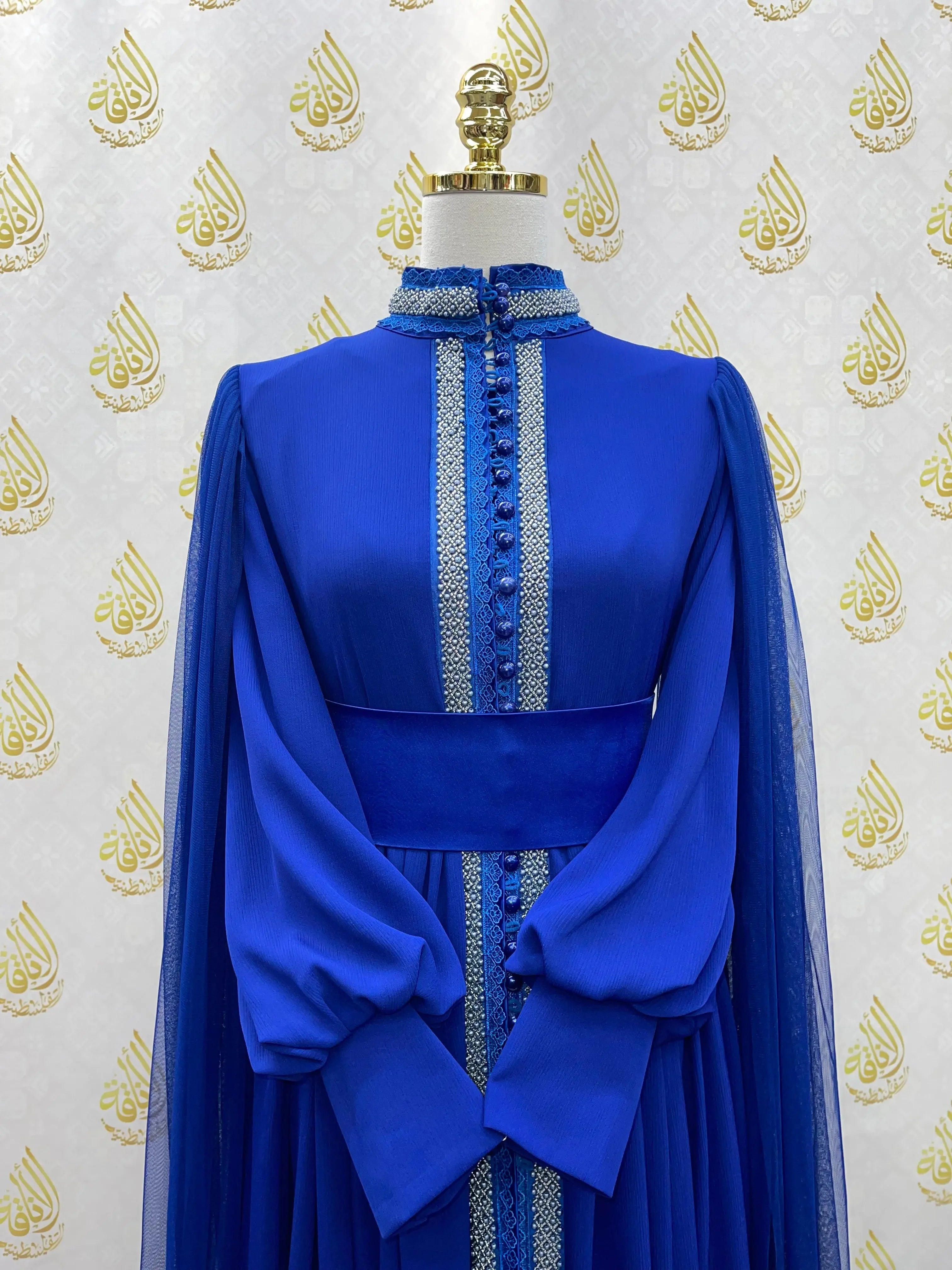 Palestinian Elegance blue elegant modest formal dress with detailed embroidery and flowing sleeves