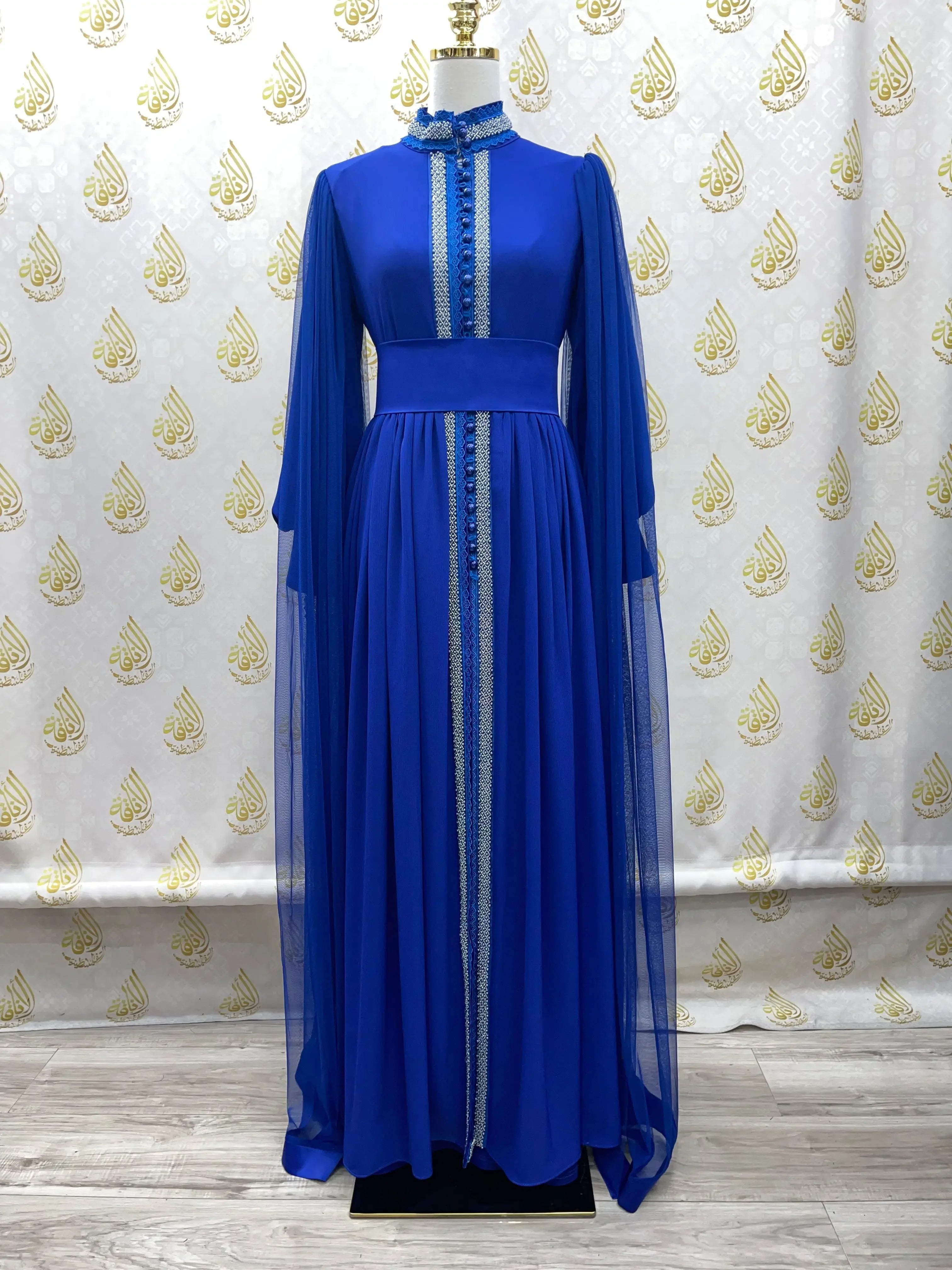Palestinian Elegance blue elegant modest formal dress with long sleeves and detailed trim