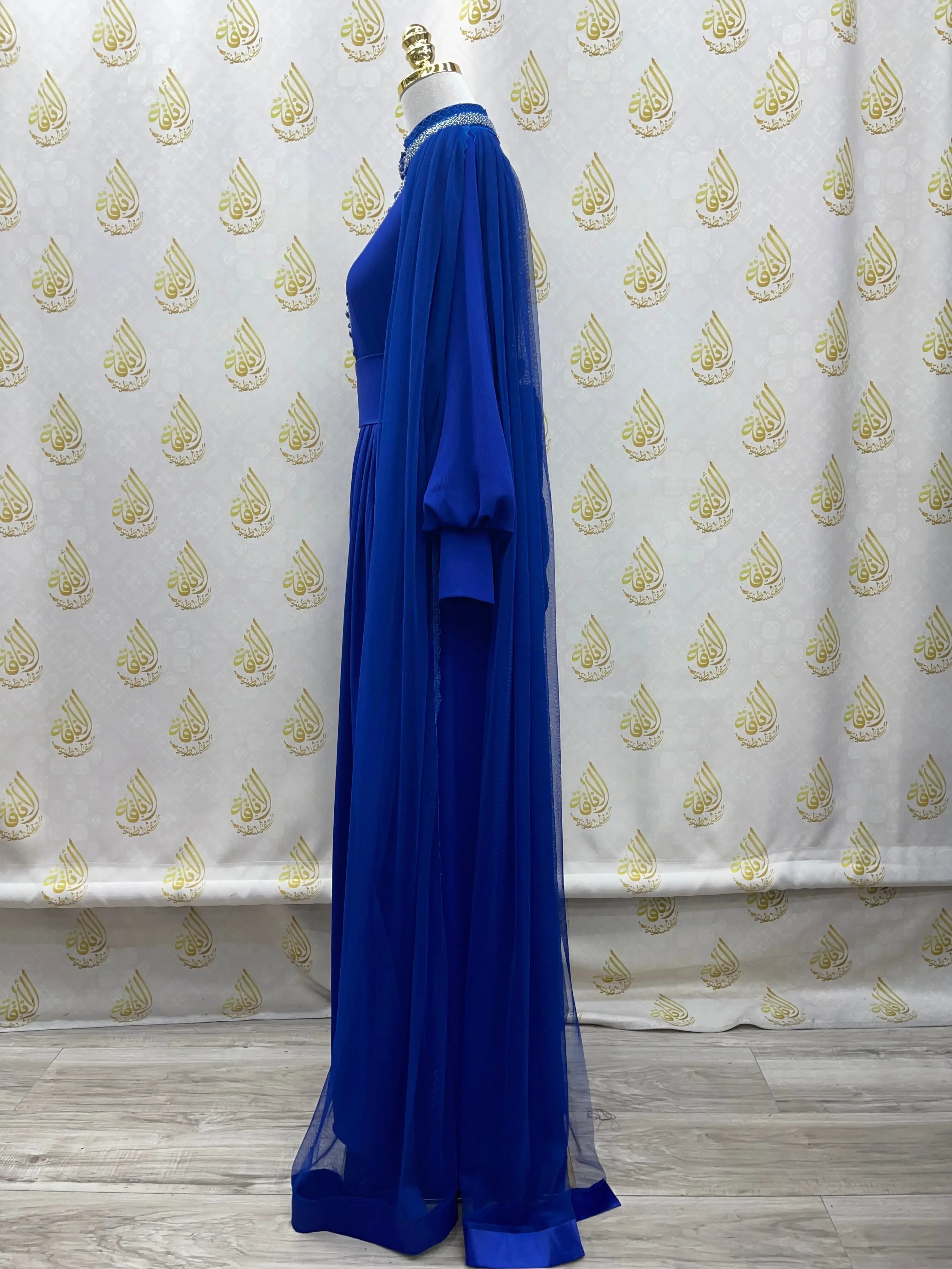 Palestinian Elegance blue elegant modest formal dress with long sheer sleeves and floor-length design