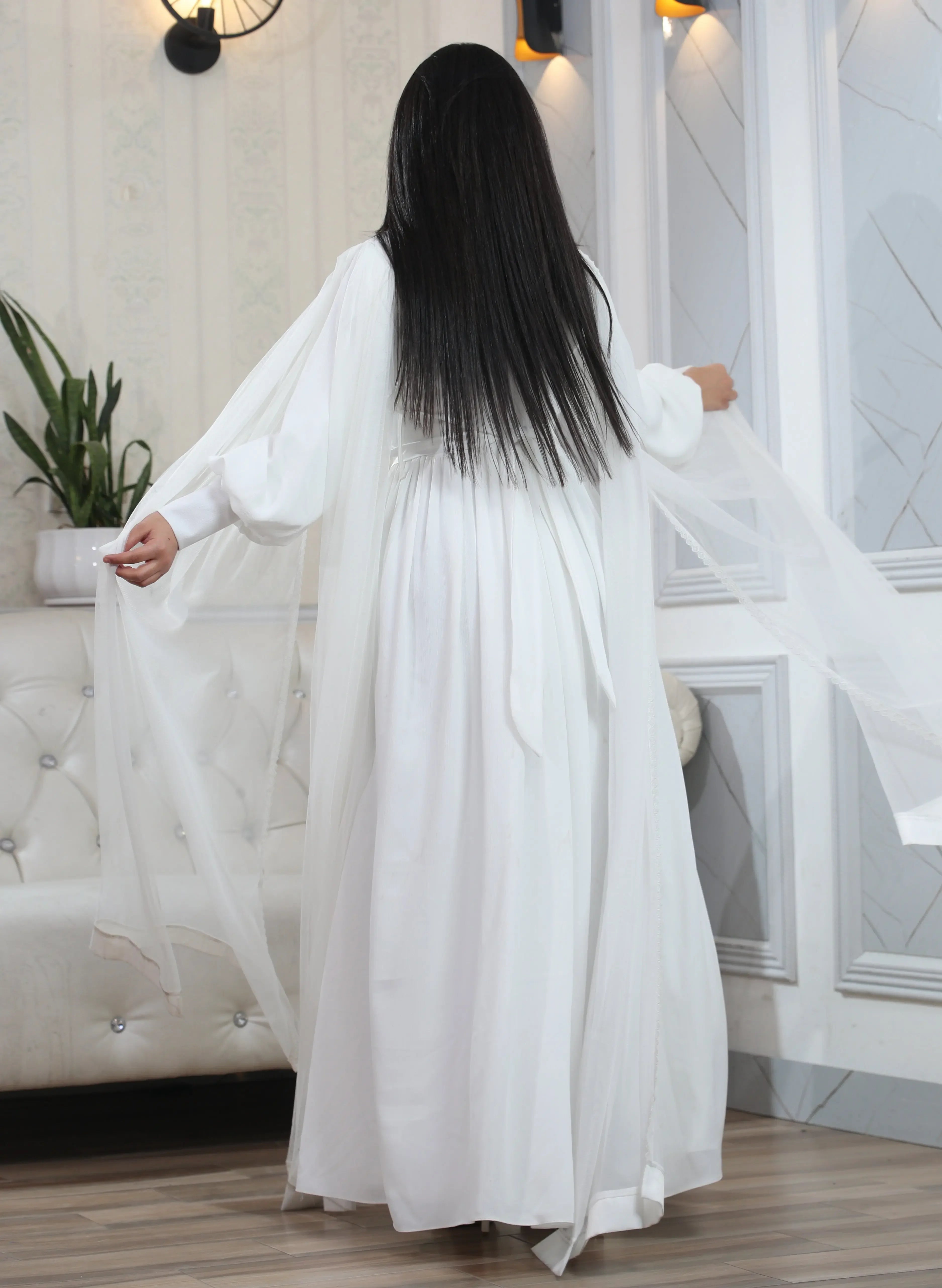Palestinian Elegance elegant modest formal dress in white with long flowing sleeves and lightweight fabric