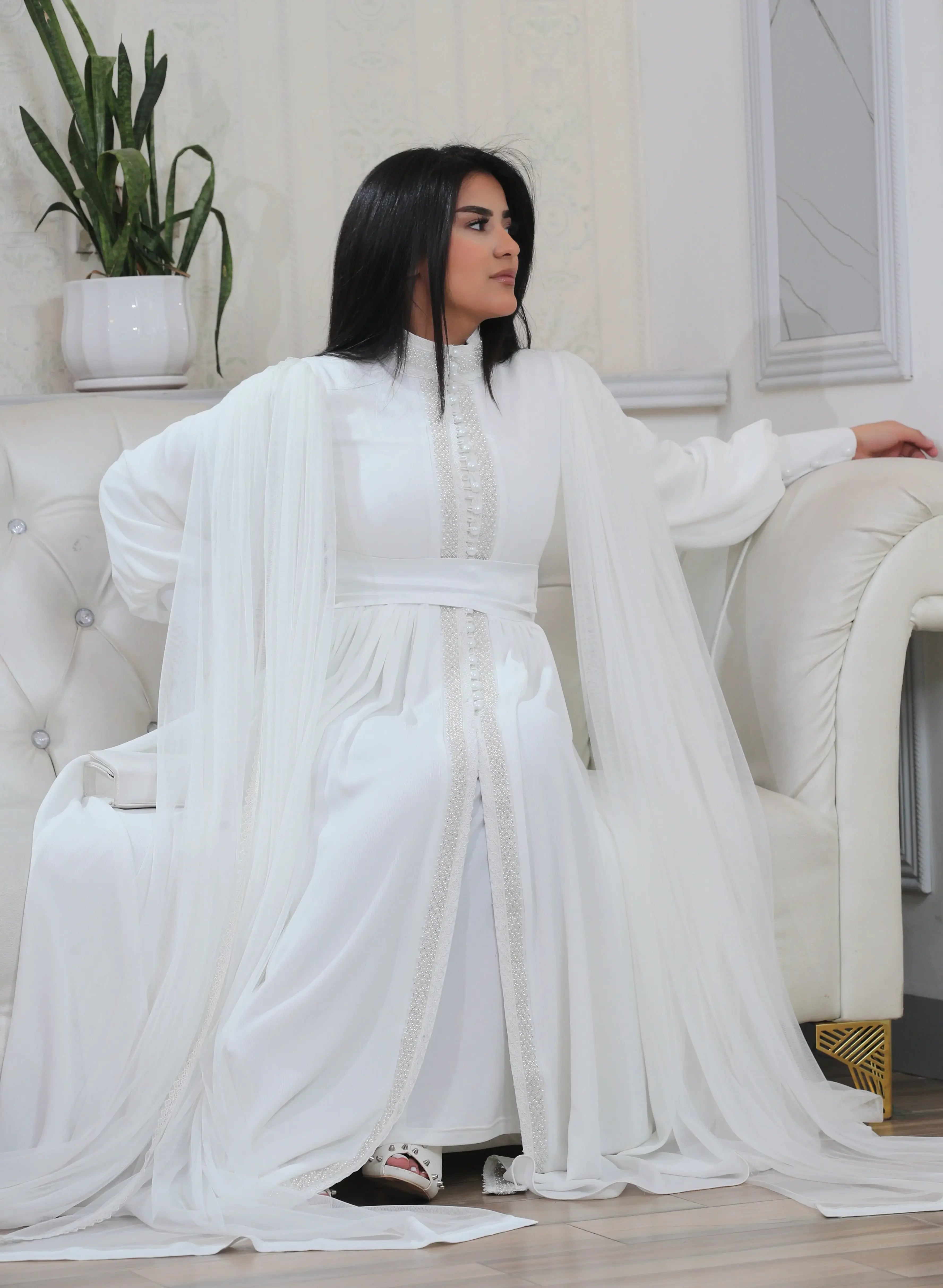 Palestinian Elegance white elegant modest formal dress with long flowing sleeves and buttoned front