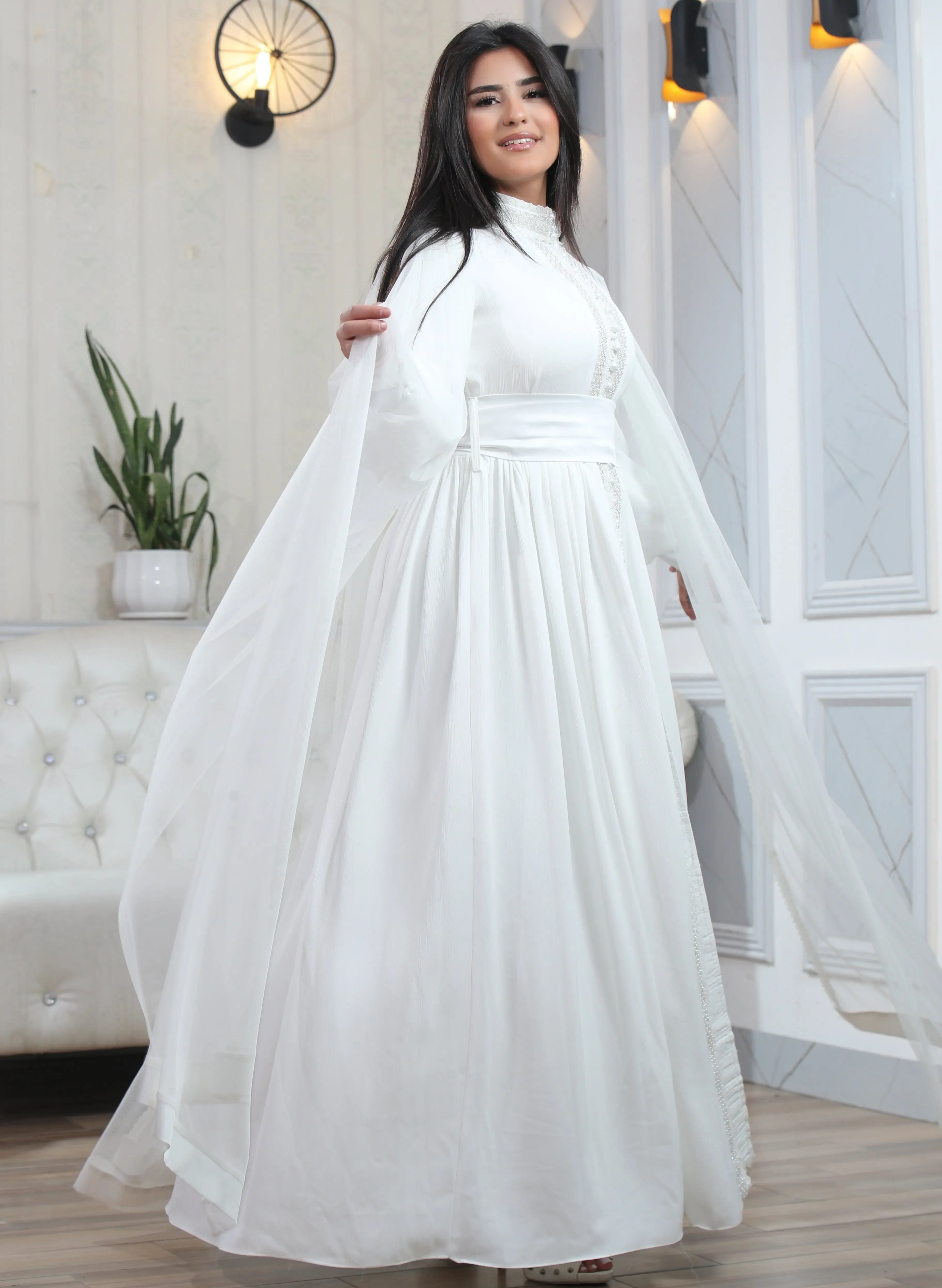 Palestinian Elegance elegant modest formal dress in white with long flowing sleeves and high neckline