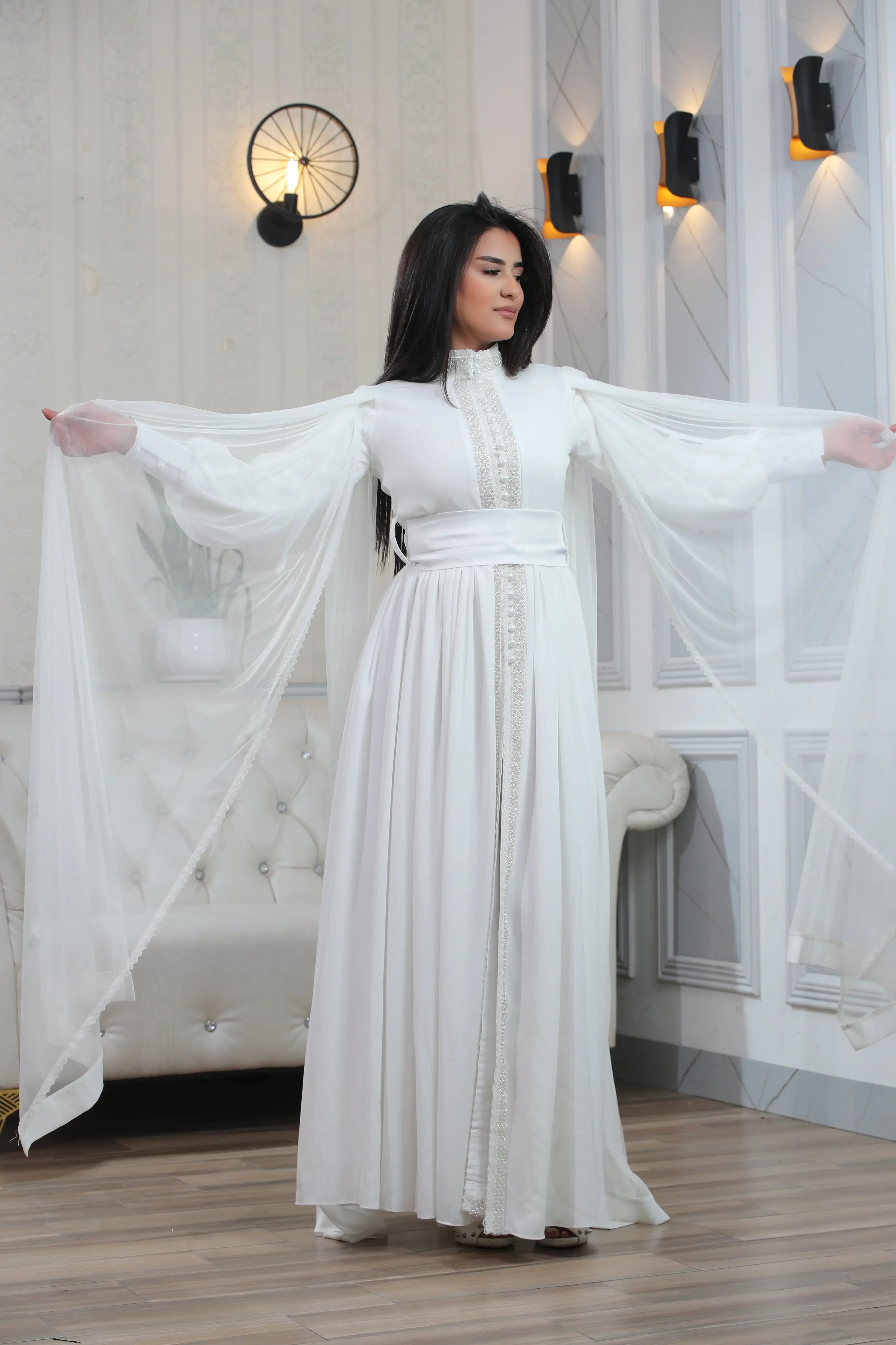 White elegant modest formal dress with long flowing sleeves by Palestinian Elegance
