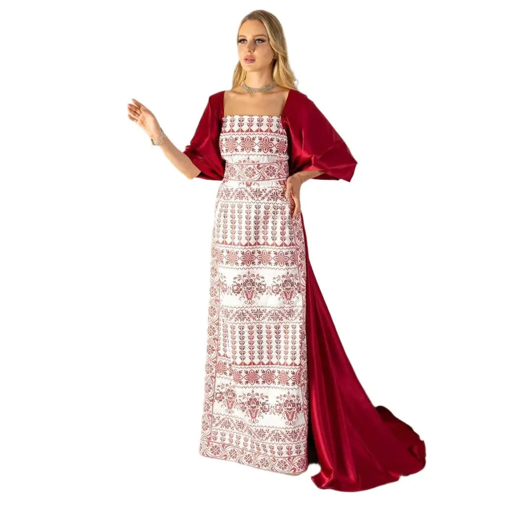 Elegant Palestinian thoub dress with red embroidery and flowing satin train by Palestinian Elegance