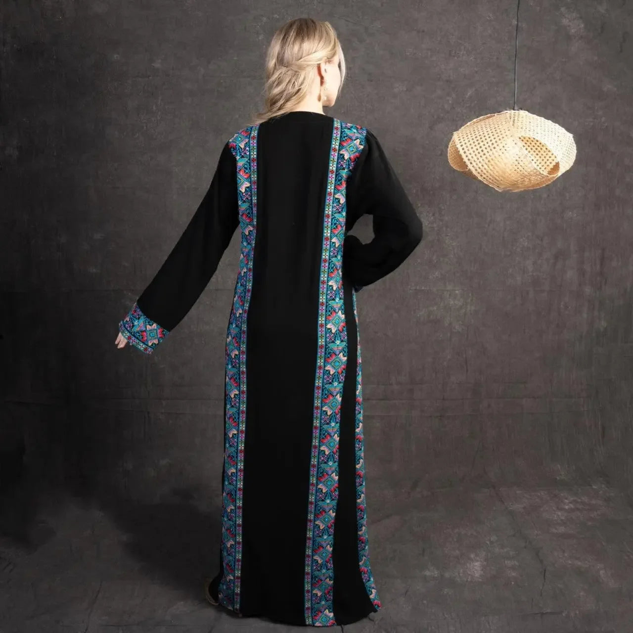Black embroidered abaya dress with colorful traditional Palestinian embroidery on back and cuffs