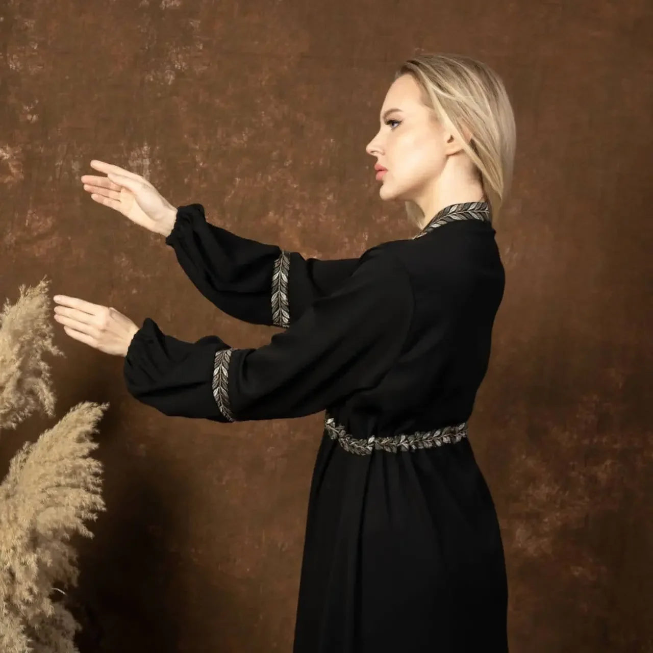 Palestinian Elegance black embroidered abaya dress with detailed sleeve and waist embroidery