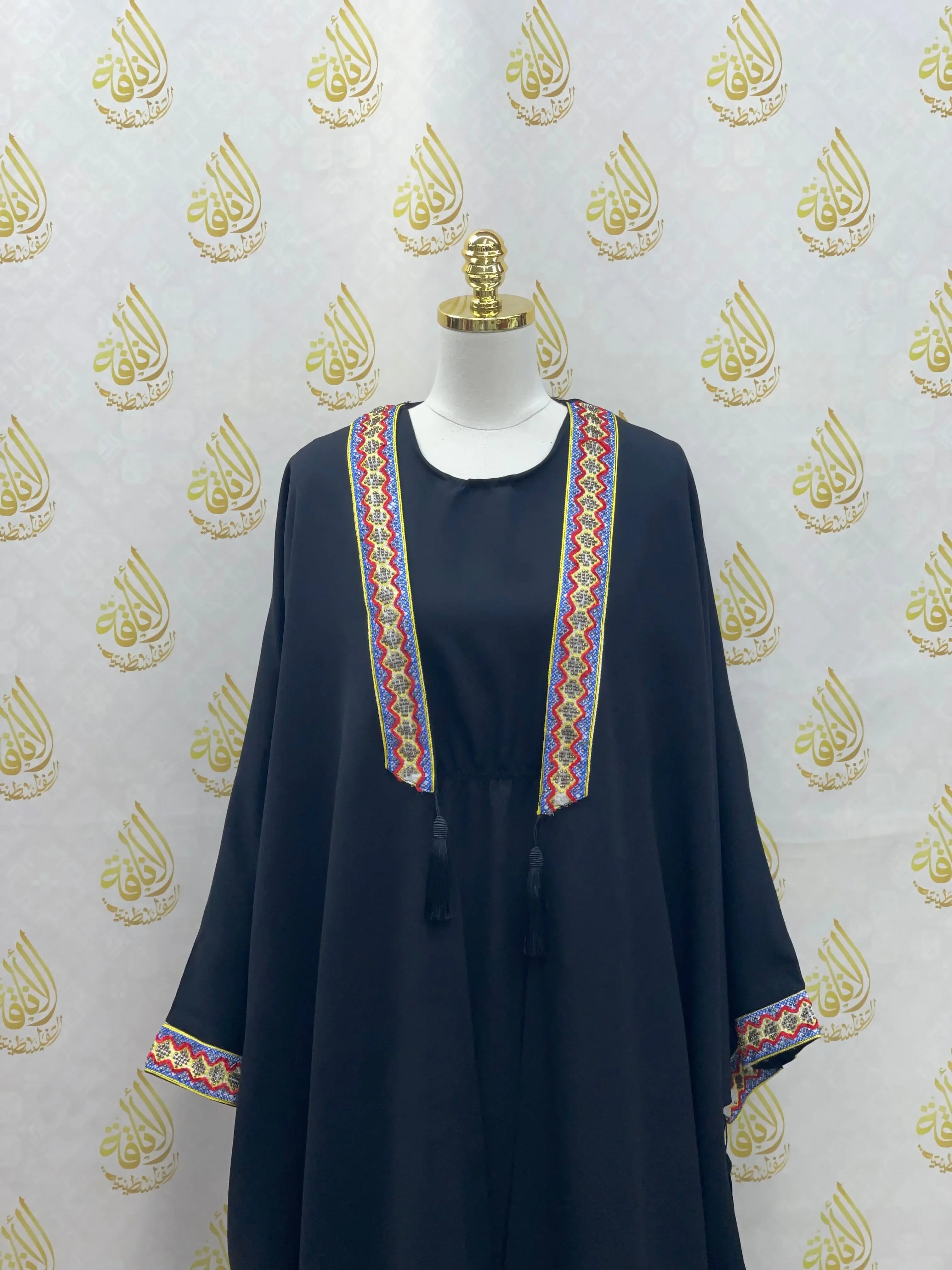 Palestinian Elegance embroidered abaya dress with colorful traditional patterns on navy fabric
