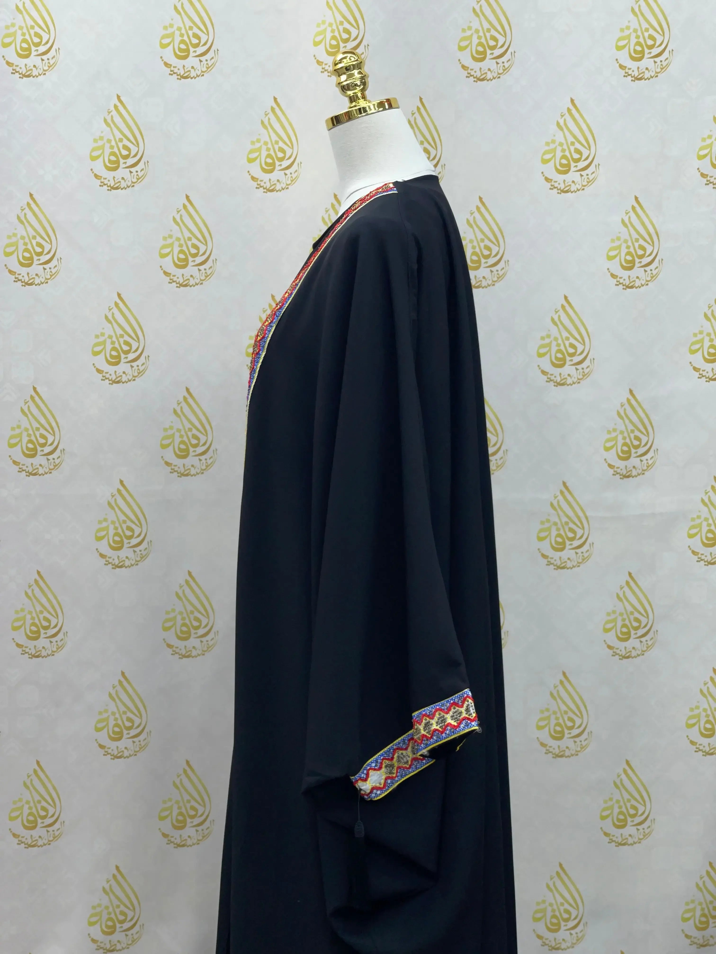 Palestinian Elegance embroidered abaya dress in black with colorful embroidery on neckline and sleeves