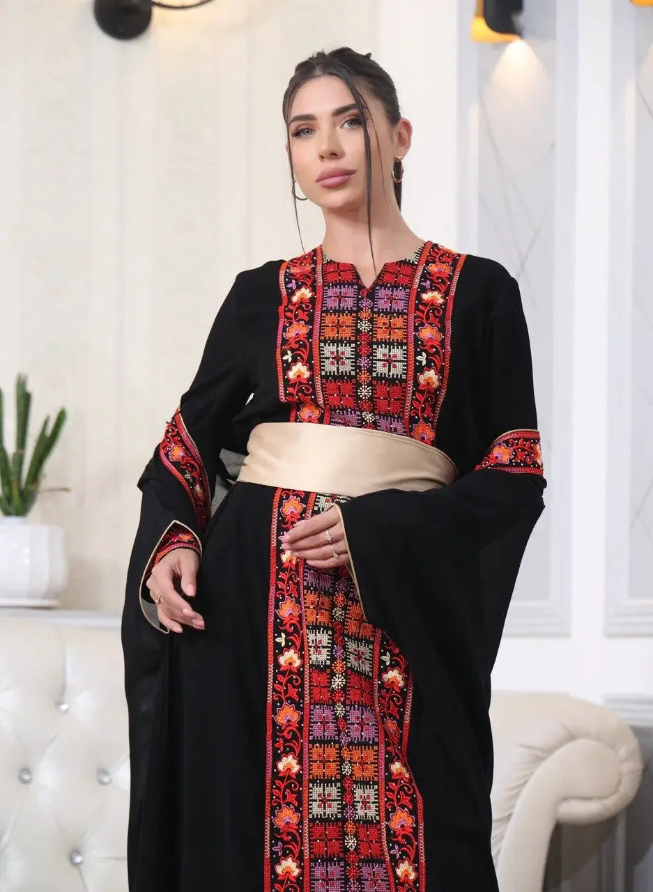 Palestinian Elegance embroidered abaya with cardigan featuring intricate red and orange embroidery on black fabric