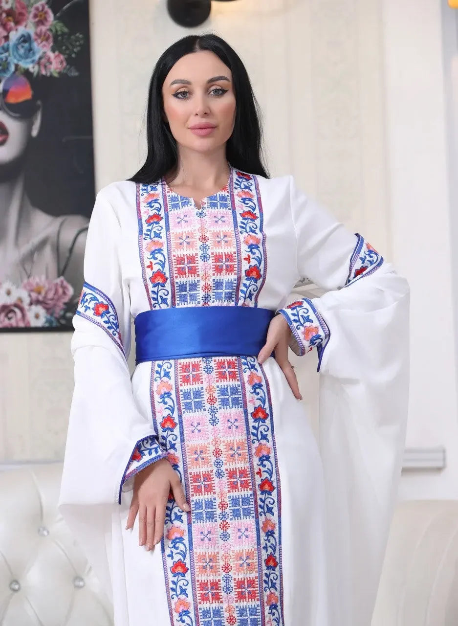 Palestinian Elegance embroidered abaya with cardigan in white featuring colorful traditional embroidery and blue sash belt