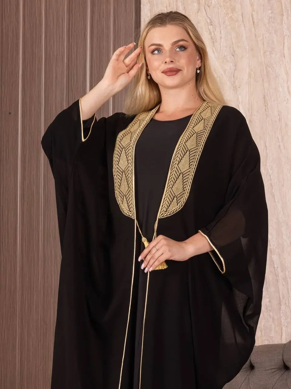 Palestinian Elegance black cardigan embroidered bisht for women with gold detailed neckline and tassel ties