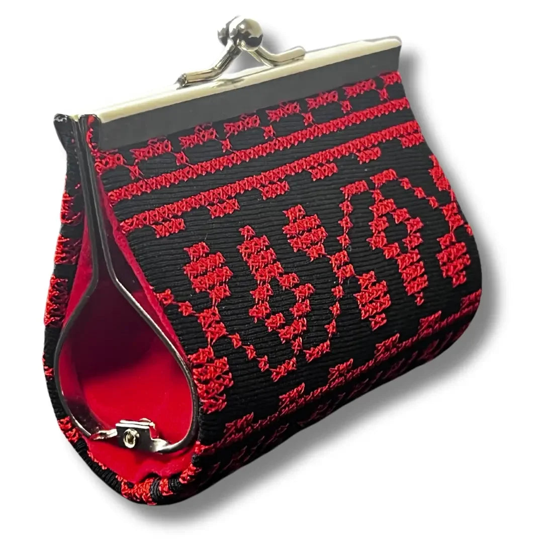 Palestinian Elegance embroidered coin wallet in black with red traditional embroidery and metal clasp closure