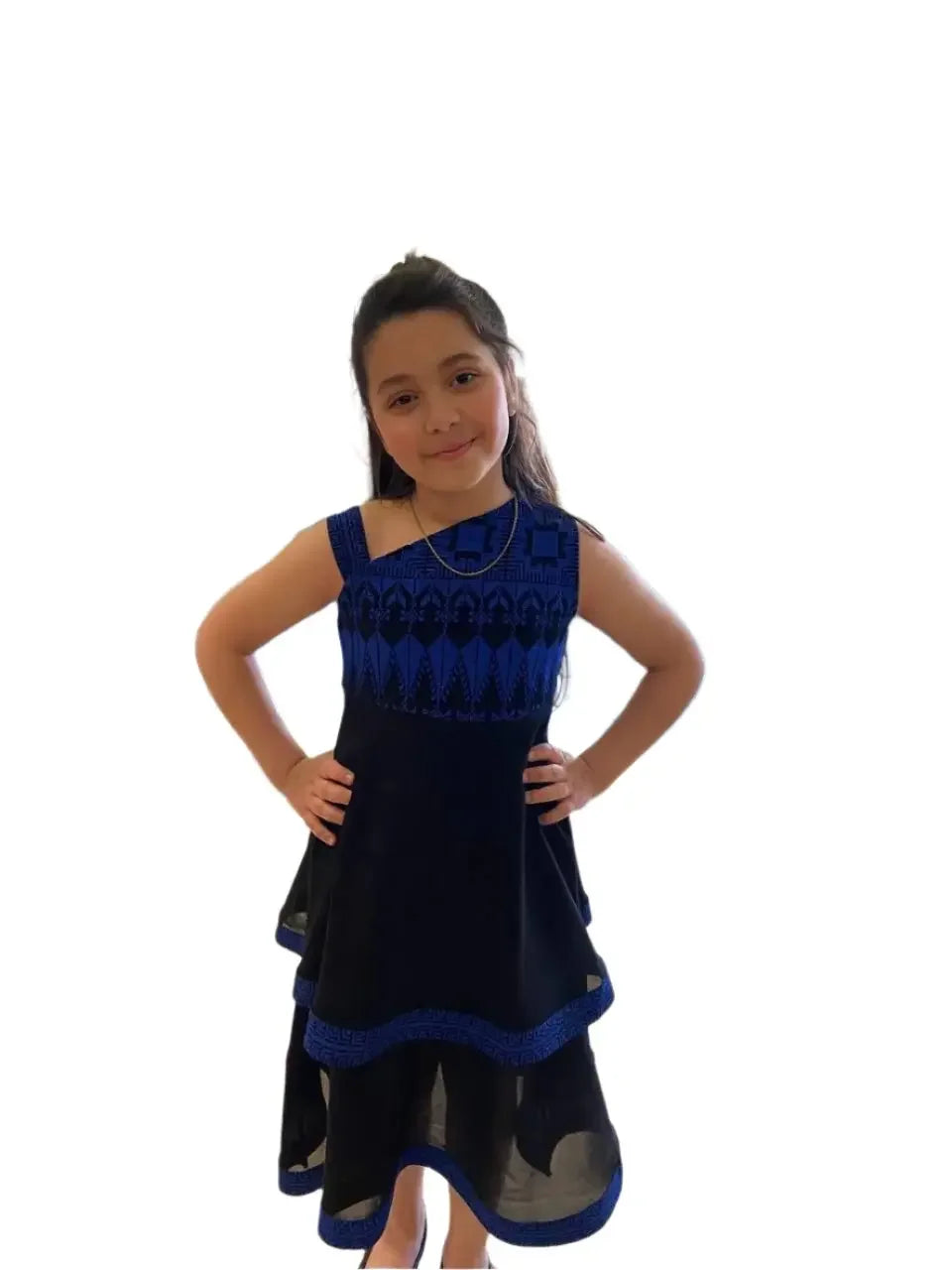 Young girl wearing a Palestinian Elegance embroidered dress for kids in black and blue with traditional patterns