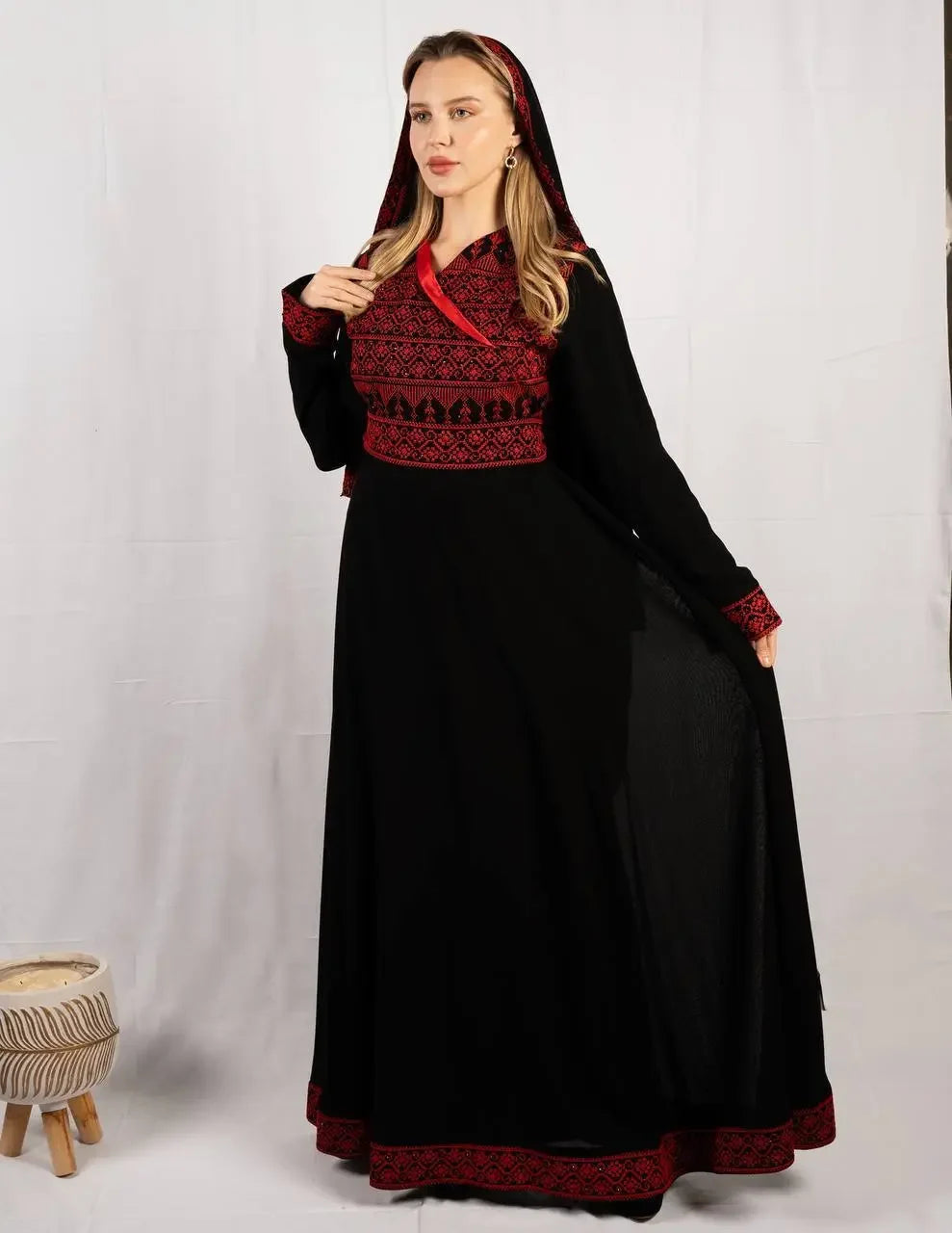 Palestinian Elegance embroidered four piece kaftan set in black with red detailed embroidery and hood