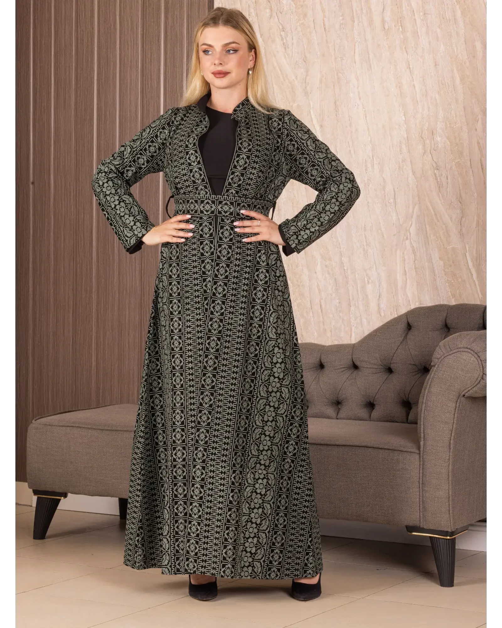 Palestinian Elegance embroidered long cardigan with intricate black and gray traditional patterns worn by woman